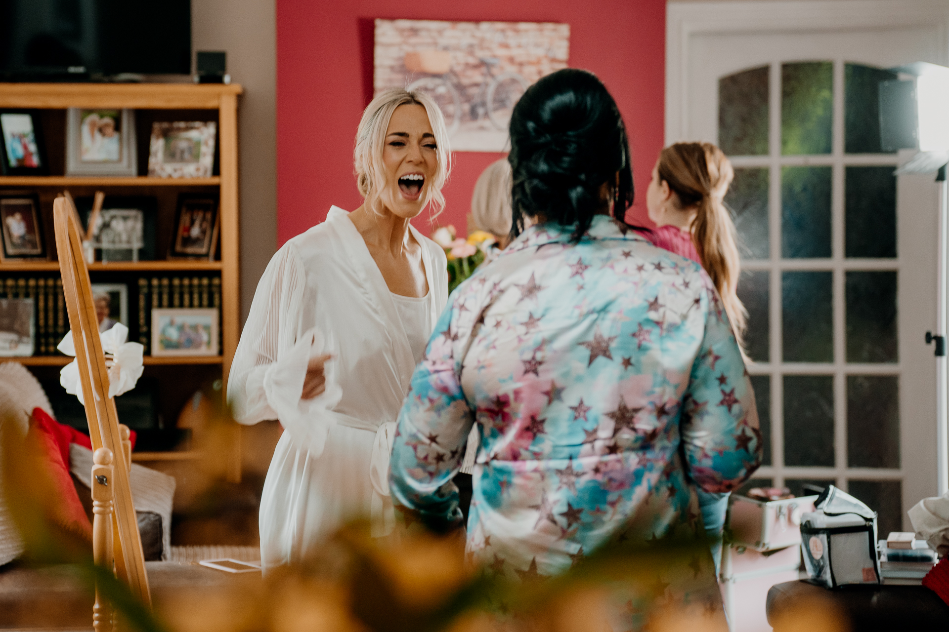 A person in a white dress laughing