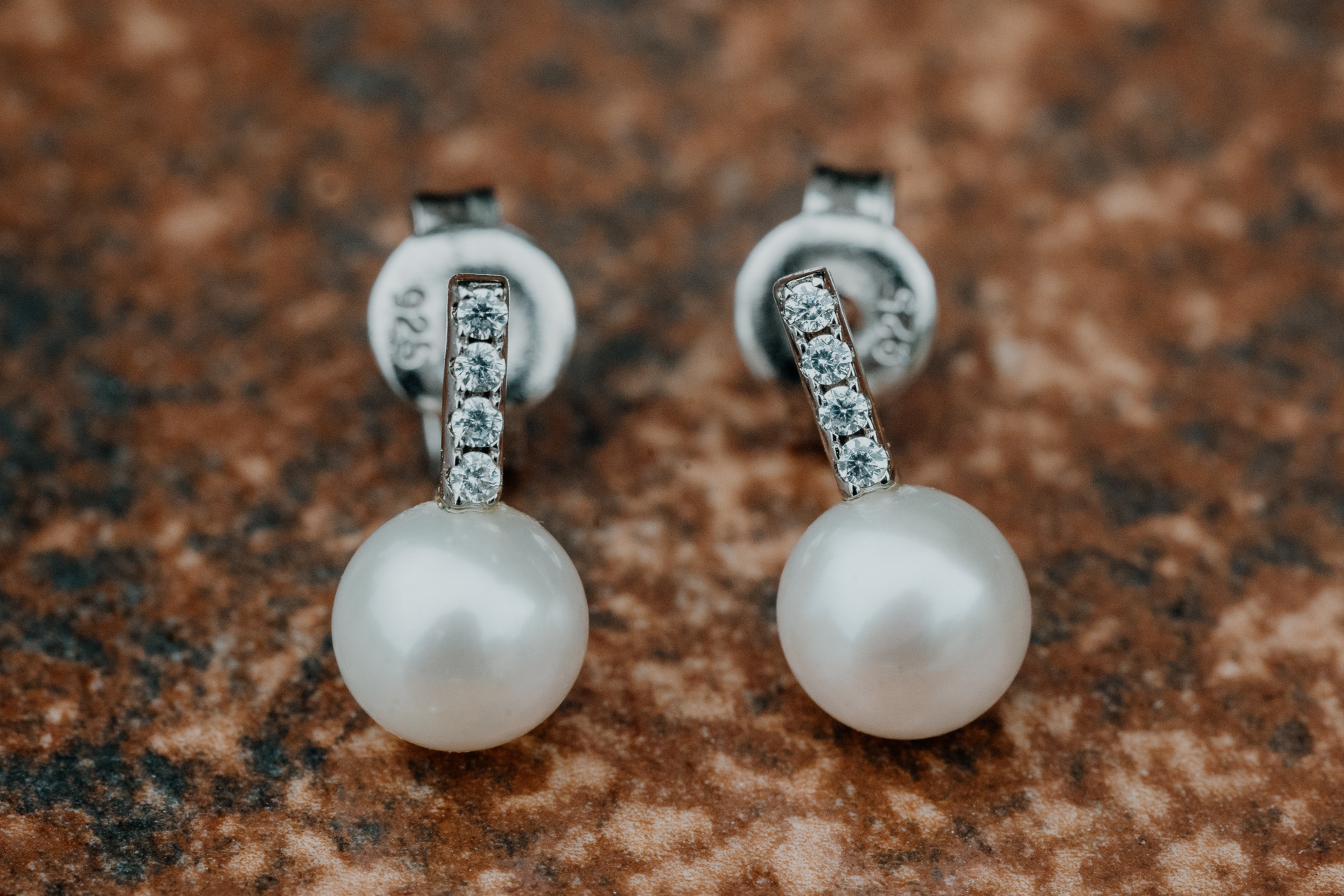 A pair of earrings on a table