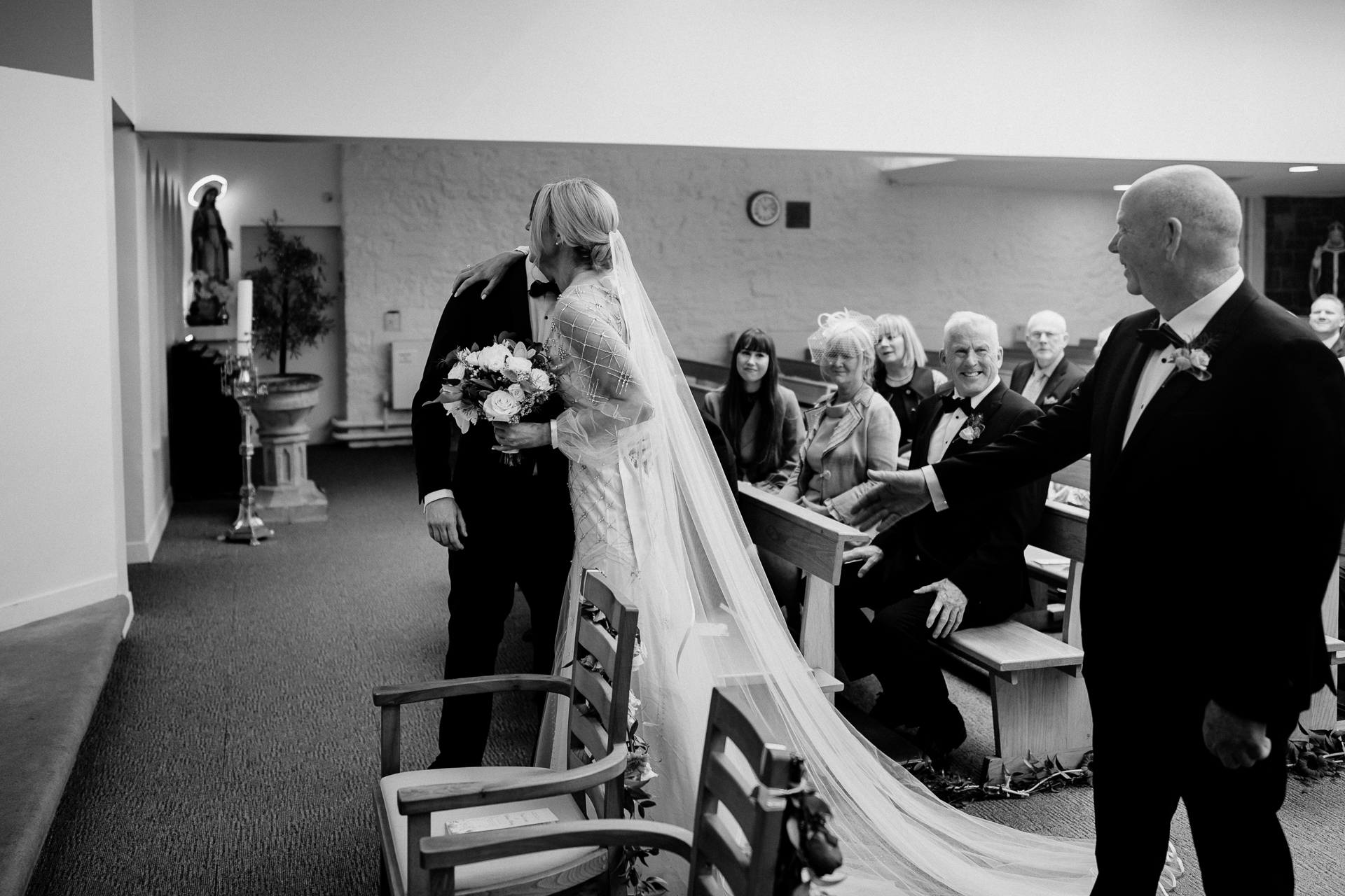 A bride and groom walking down the aisle