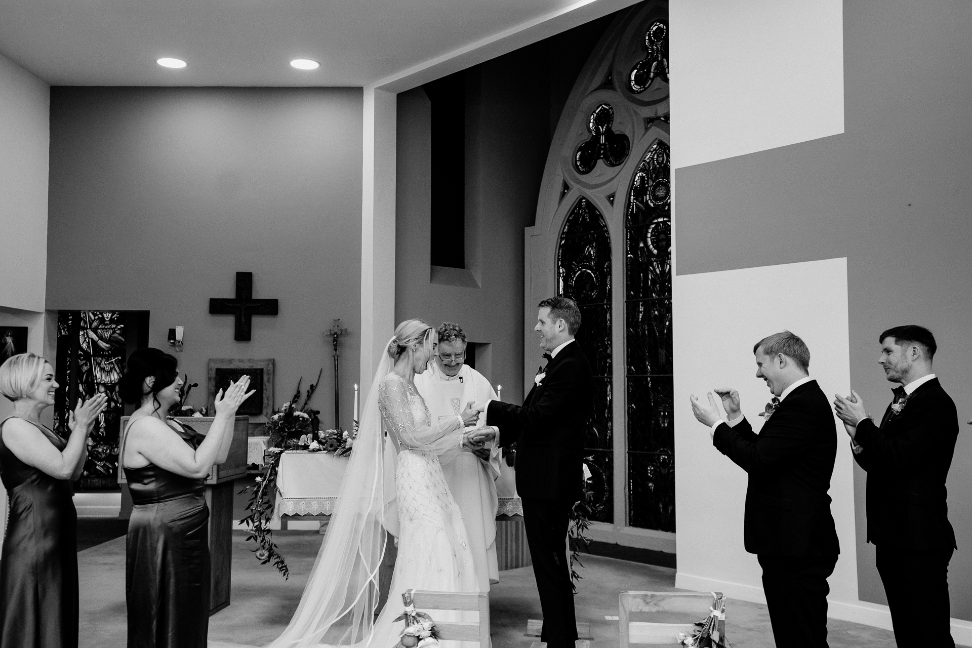 A bride and groom walking down the aisle