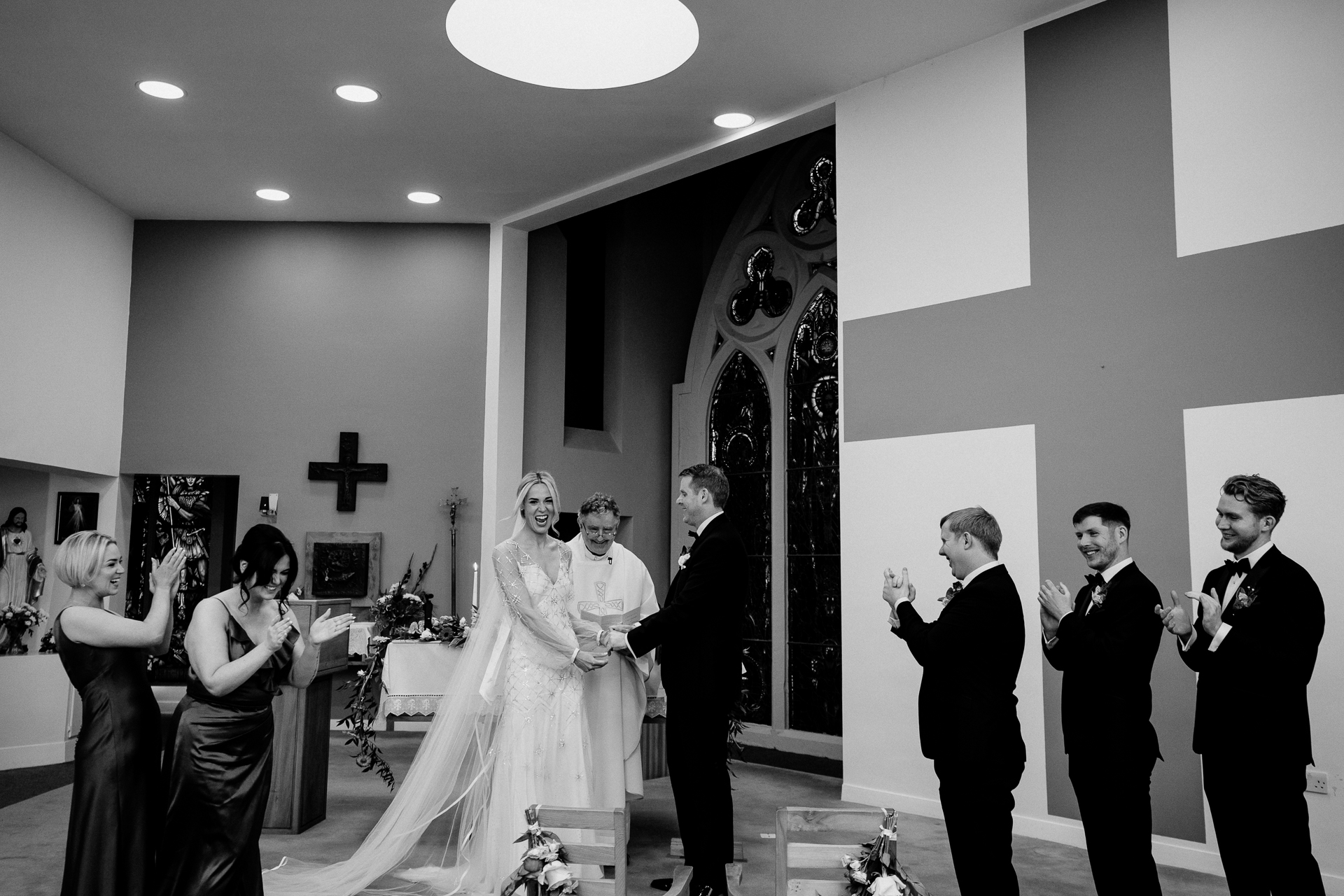 A bride and groom walking down the aisle