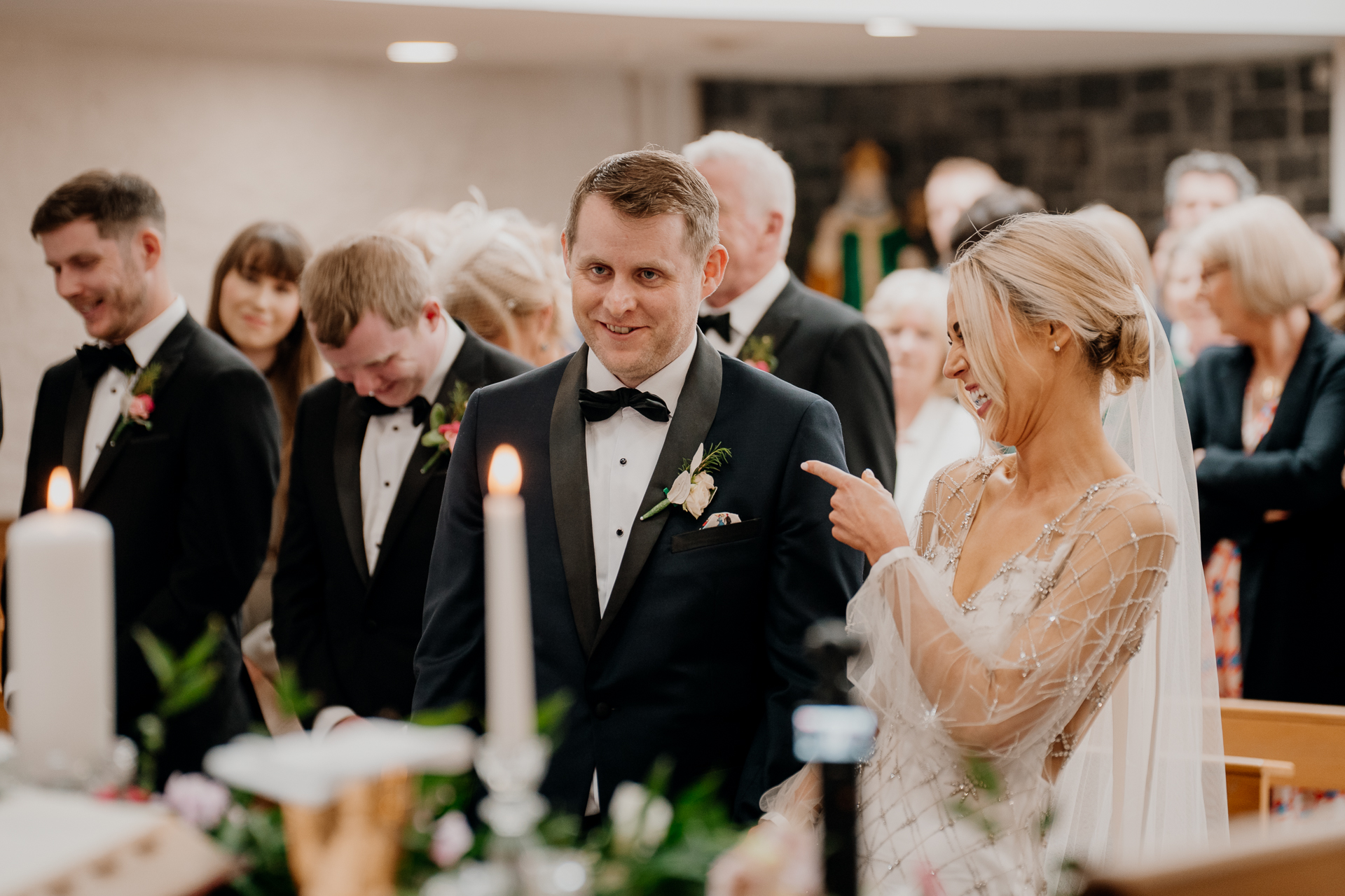 A man in a tuxedo and a woman in a white dress