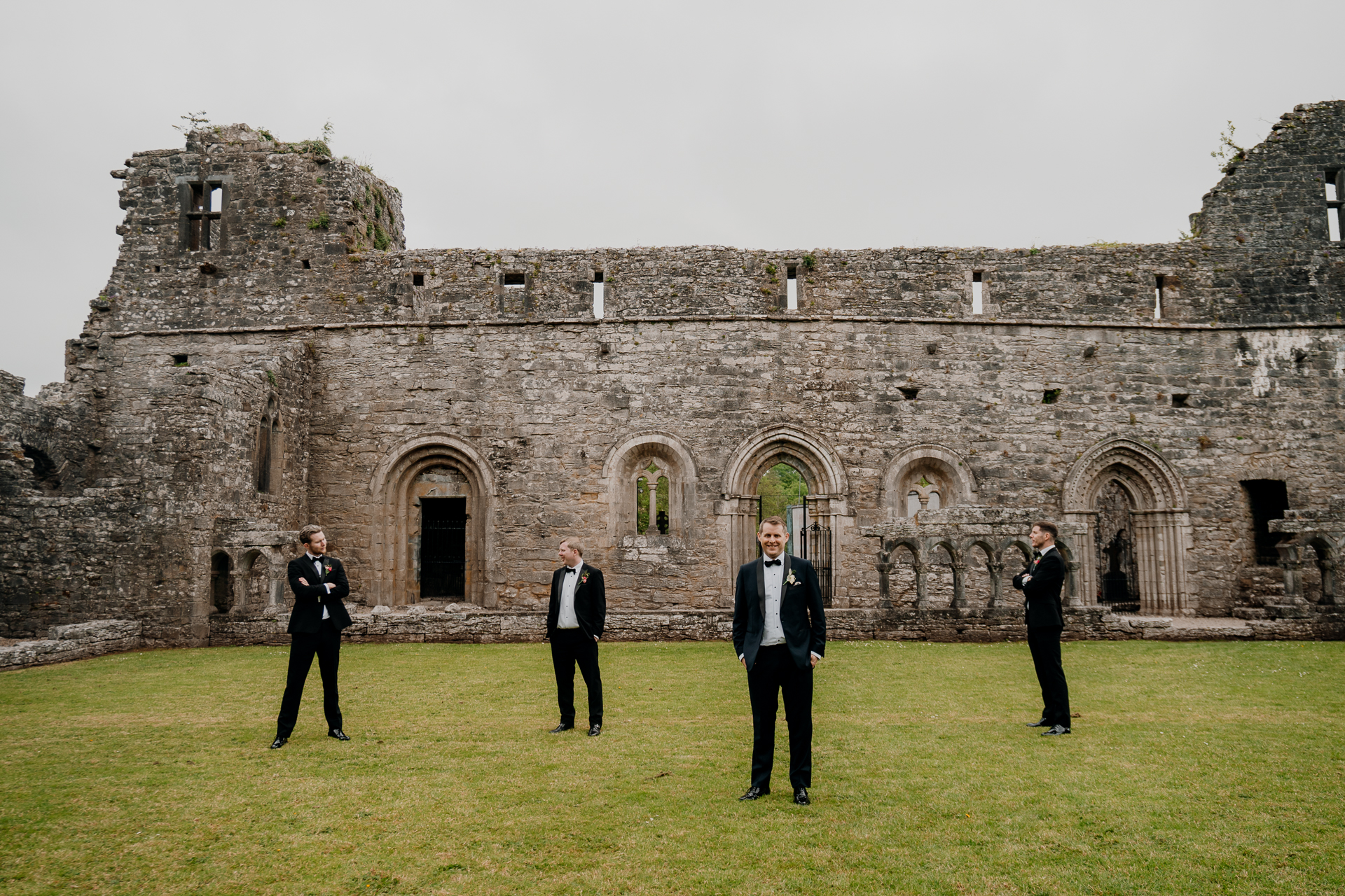 A group of men standing in front of a building