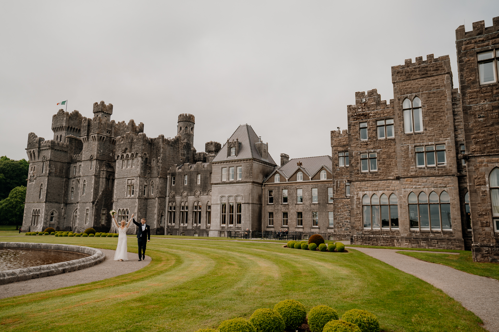 A couple walking in front of a large building