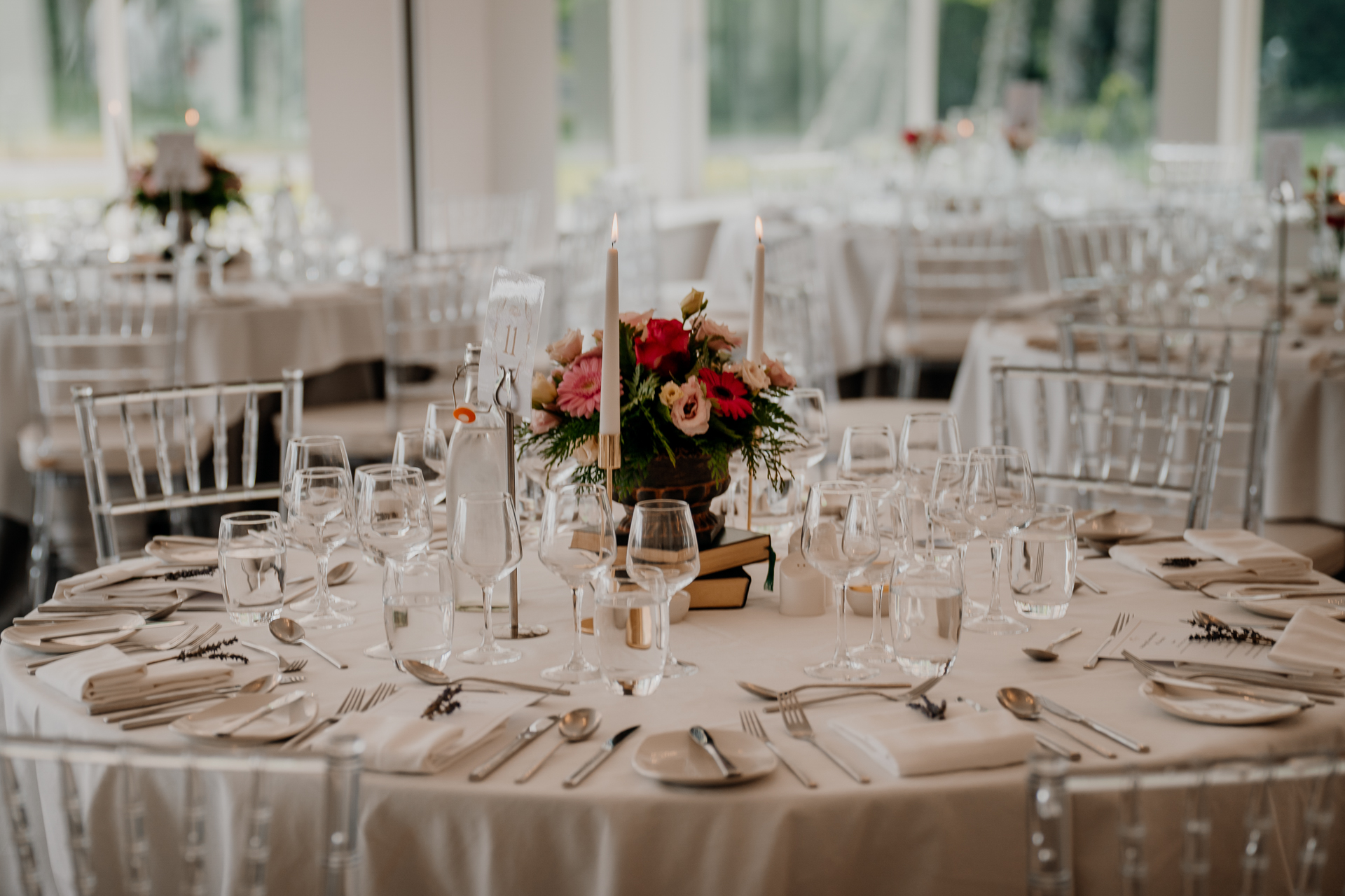 A table set with flowers and glasses