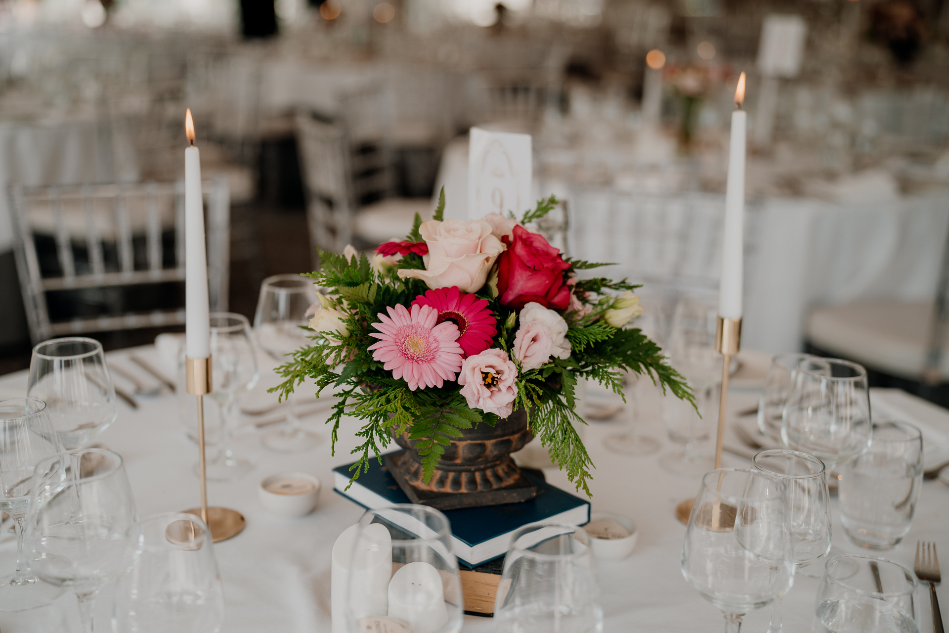 A table with flowers and candles