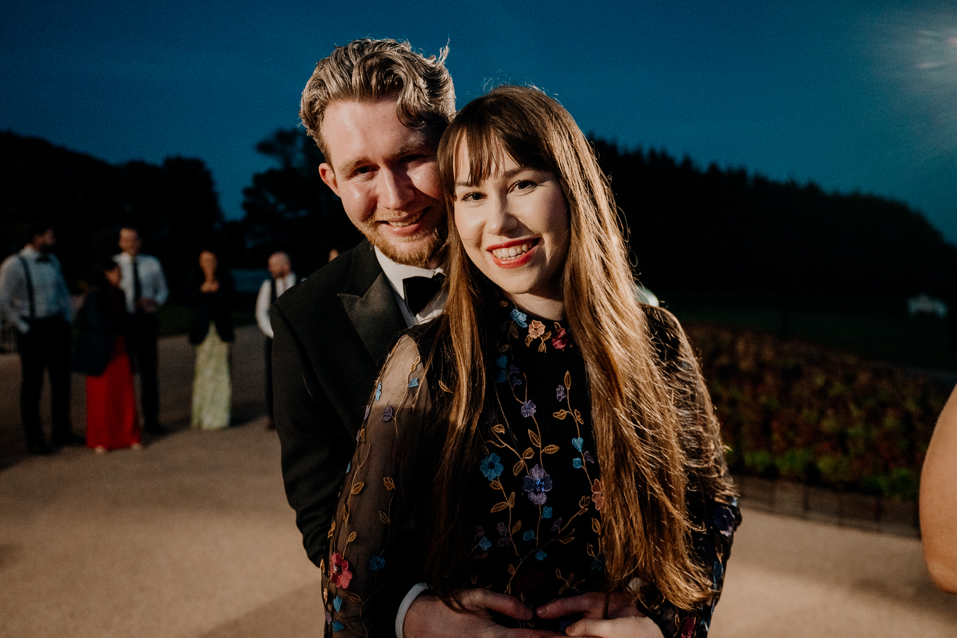 A man and woman posing for a picture