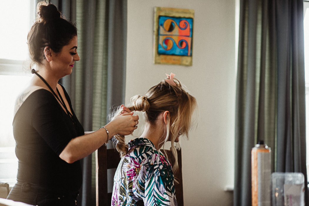 Hairstyling in prepearation for the wedding ceremony