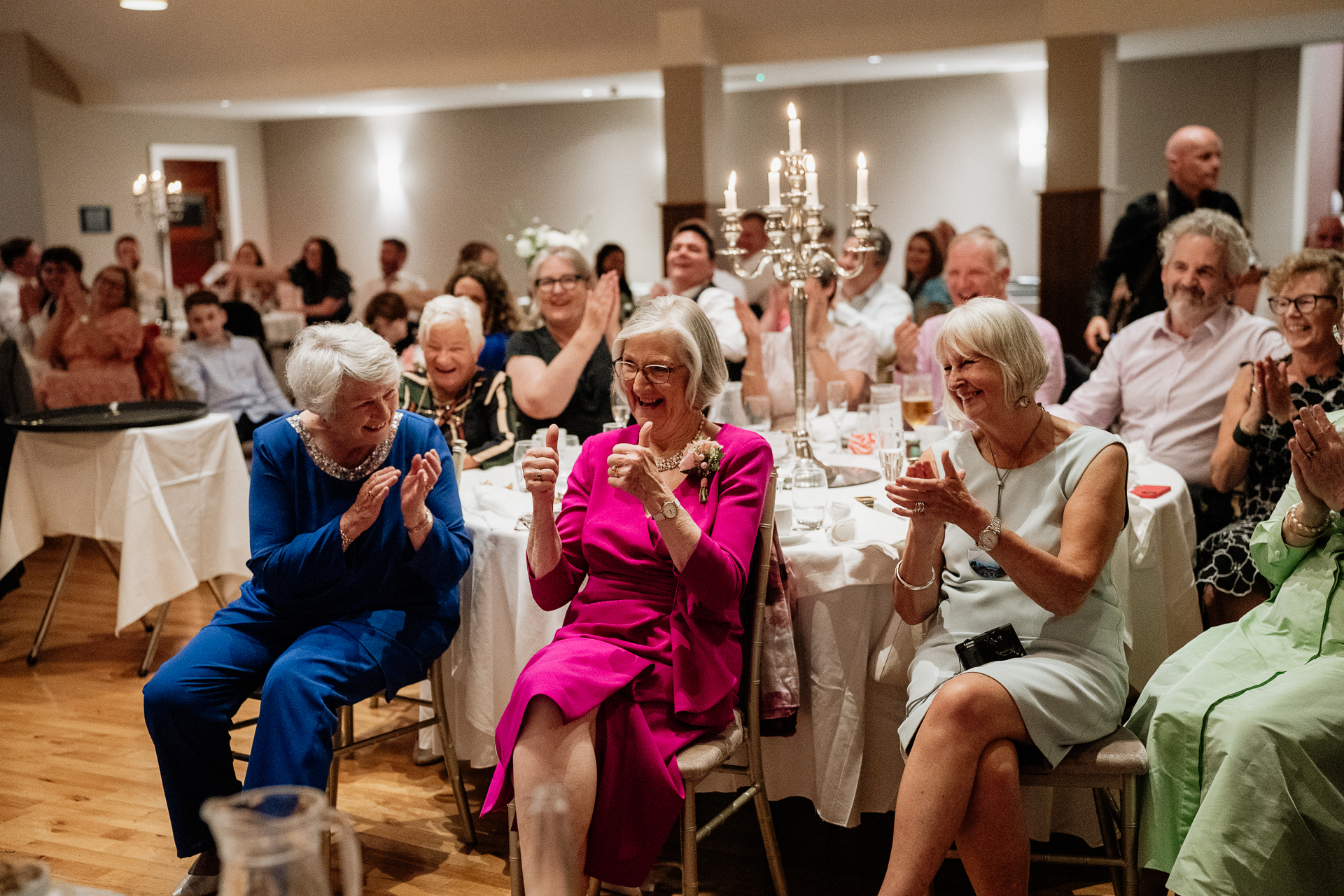 A group of people sitting at tables