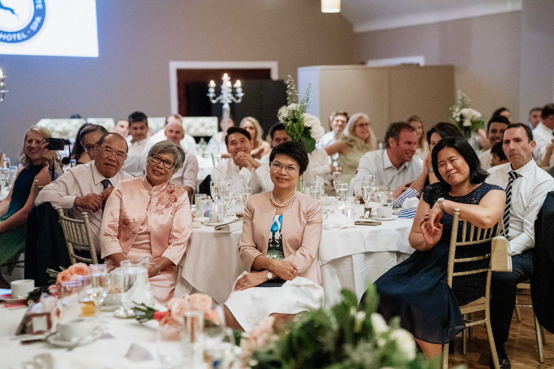 A group of people sitting at tables