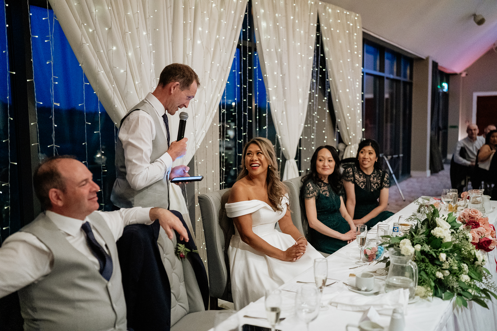 A man and woman cutting a wedding cake