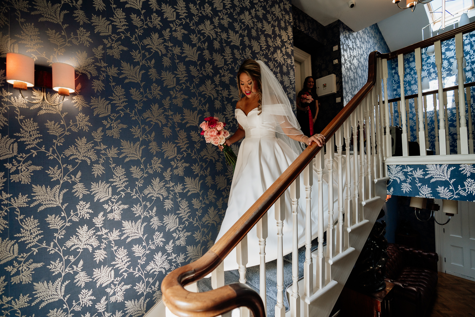 A person in a white dress on a staircase