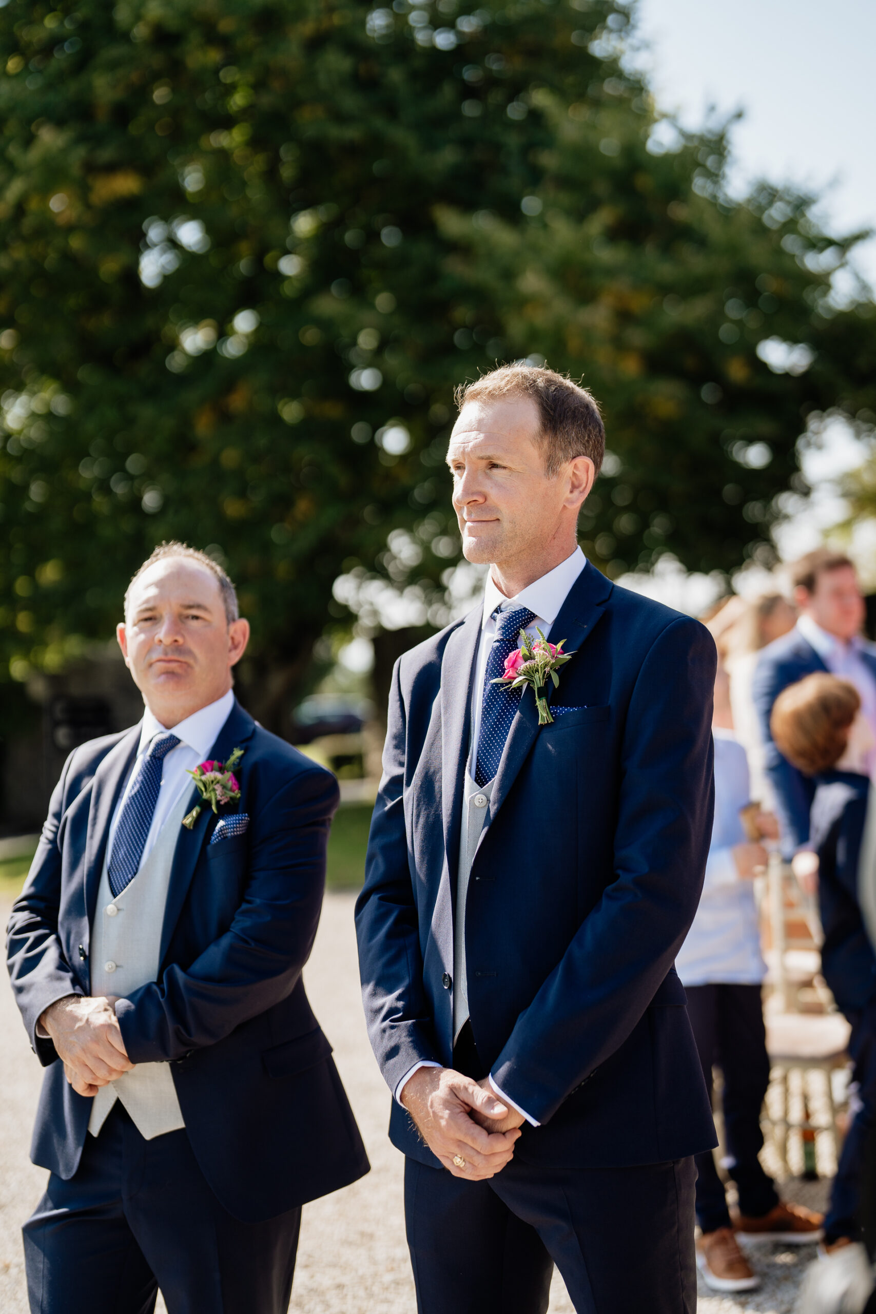 A couple of men in suits walking