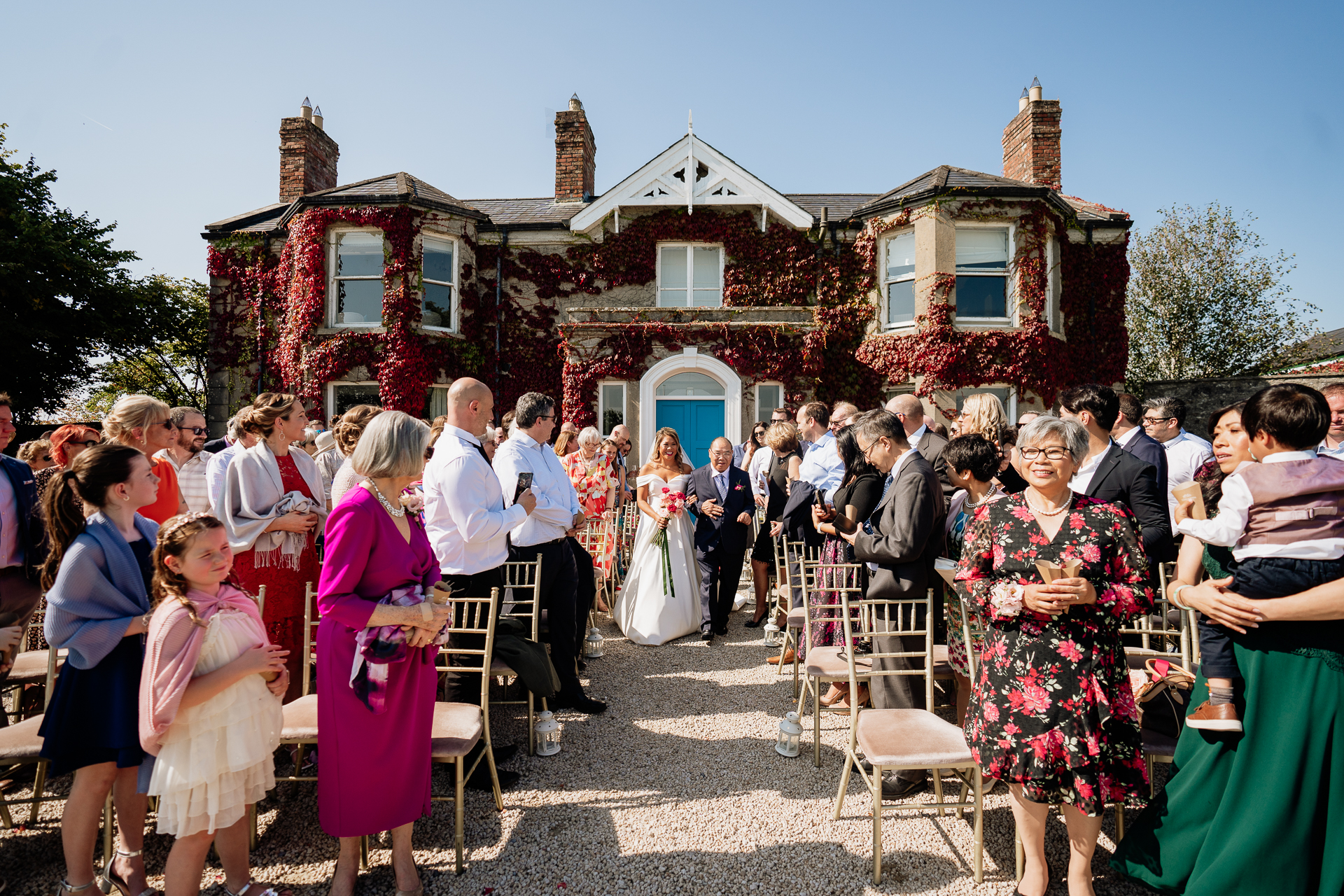 A group of people outside a house