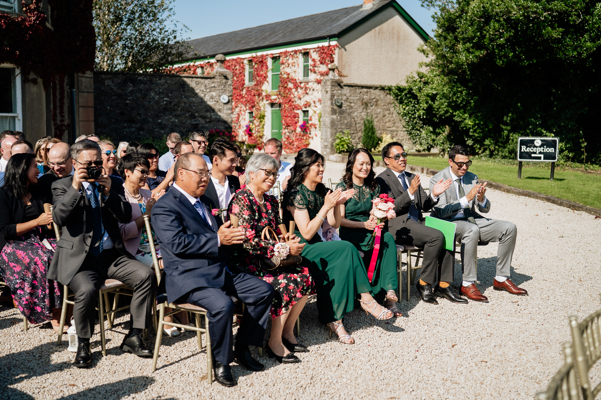 A group of people sitting outside