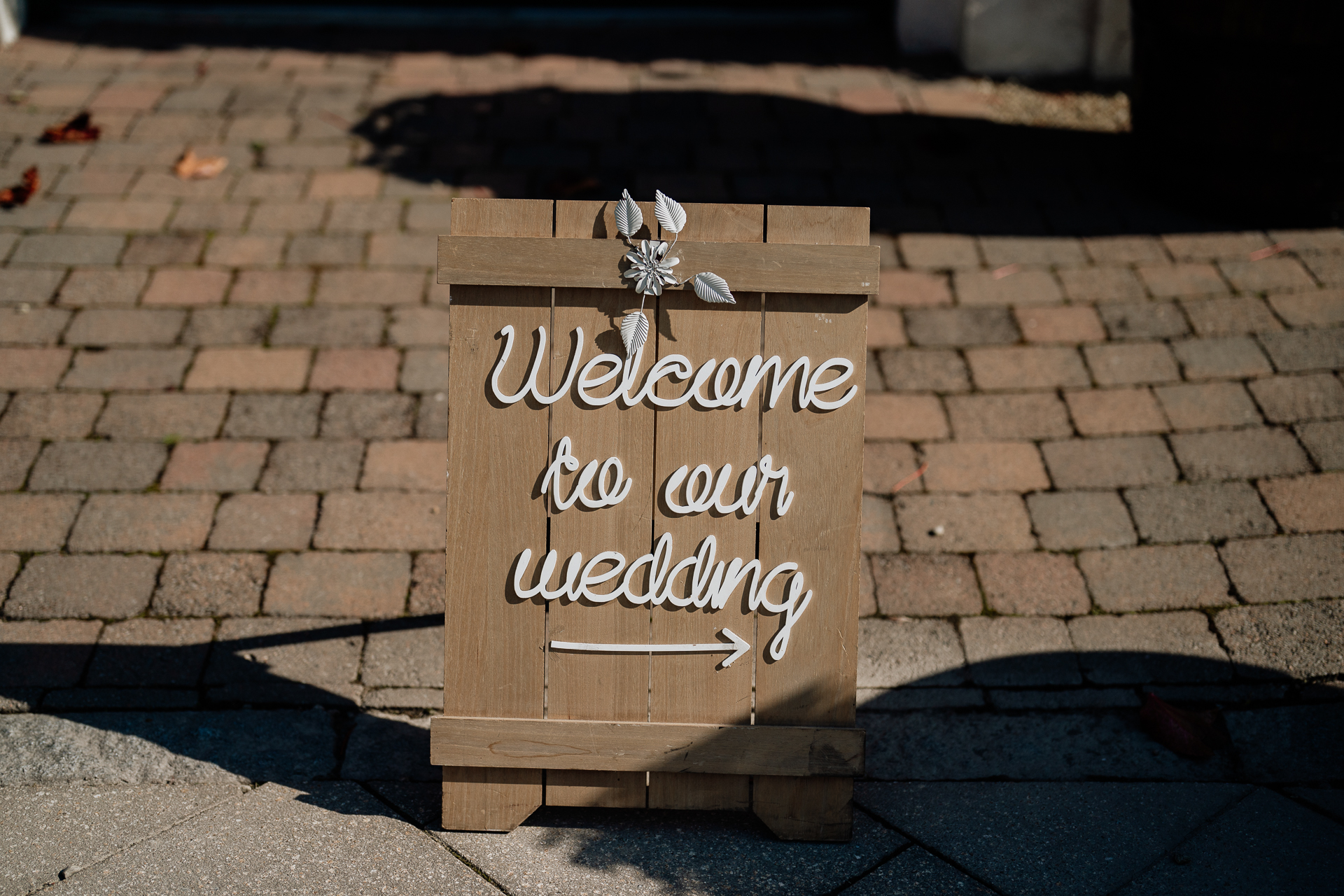 A sign on a brick surface