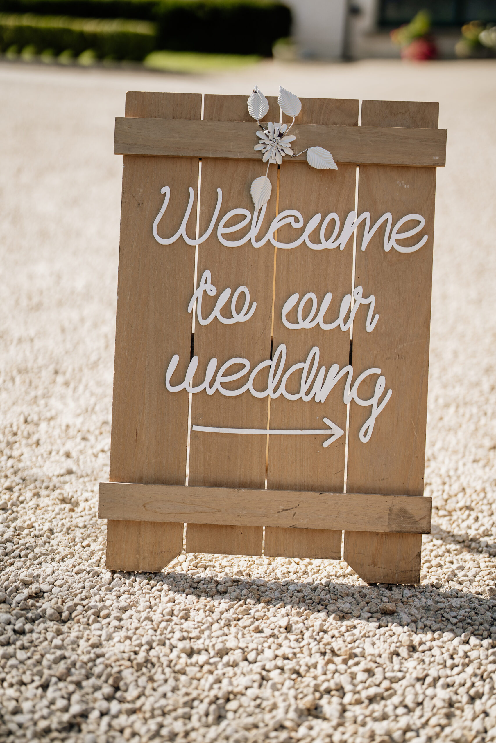 A wood sign with a crown on it