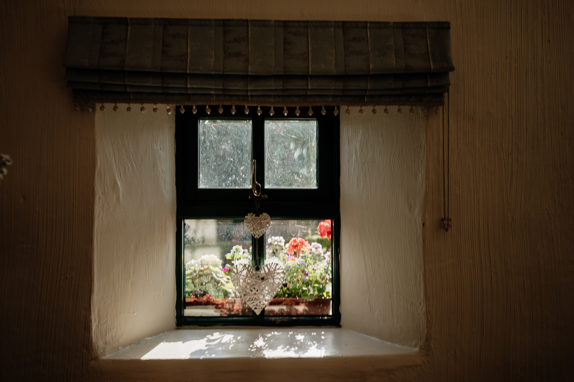 A window with flowers in it