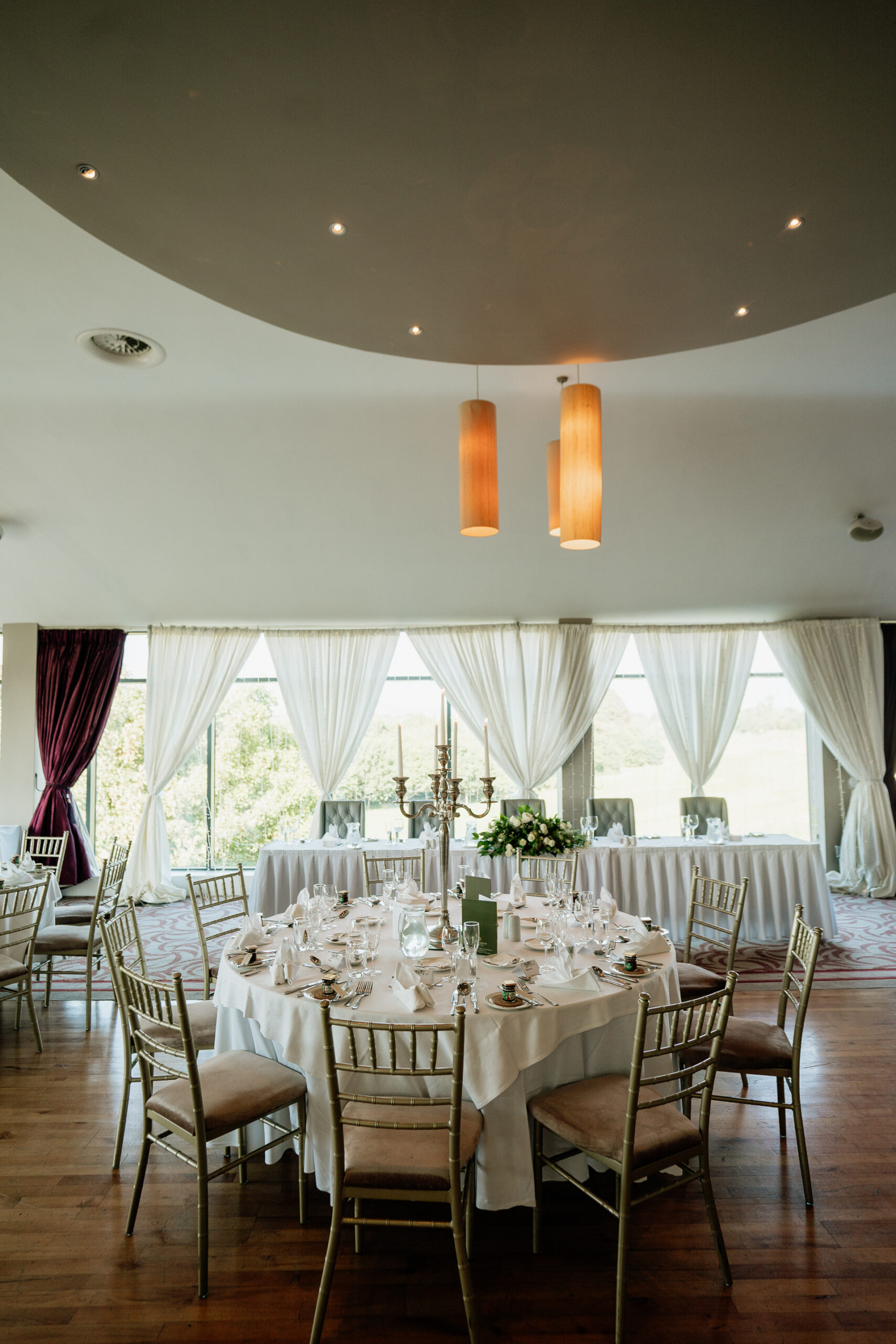 A dining room with a table set for a meal