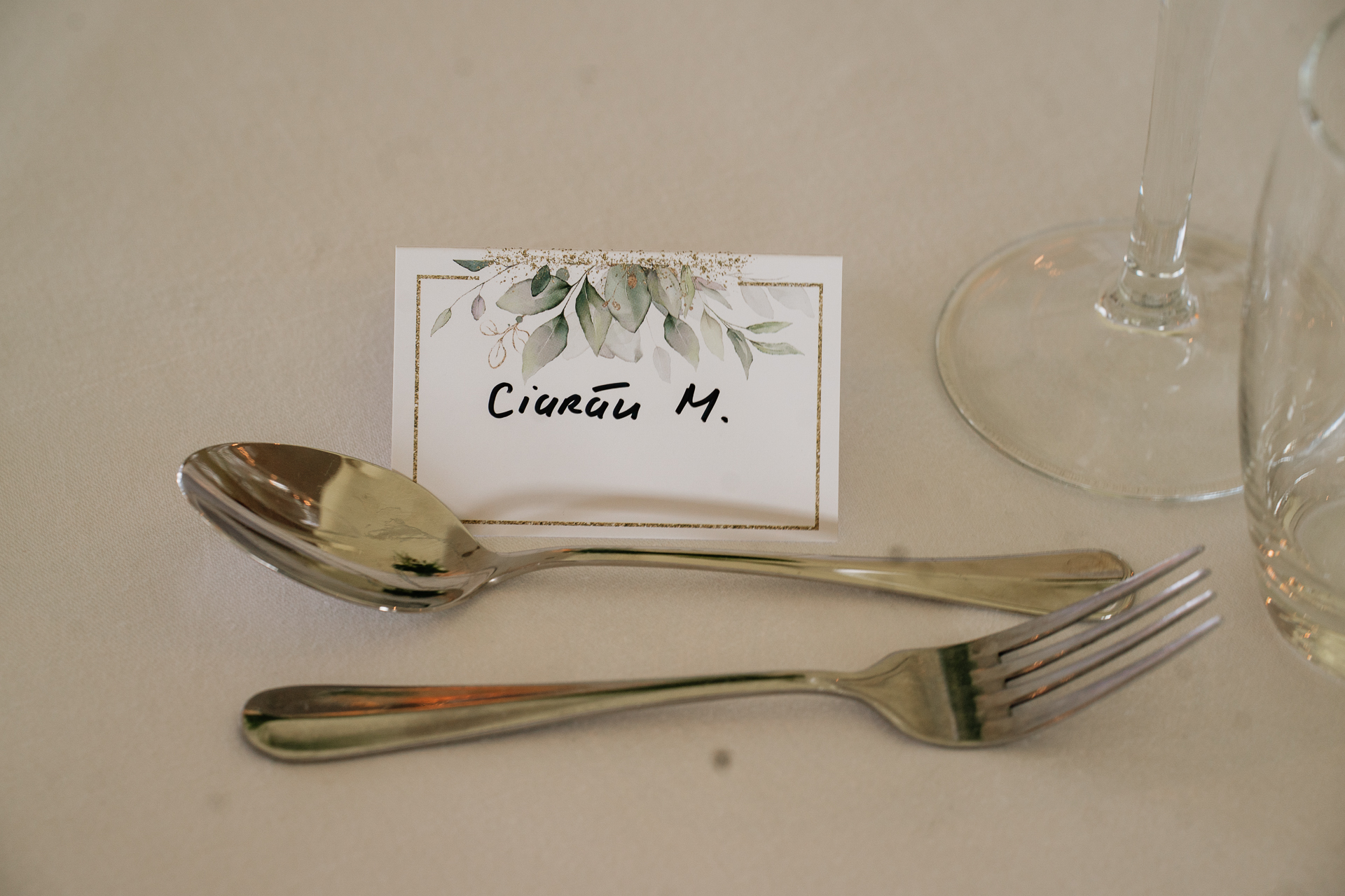 A fork and a card on a table