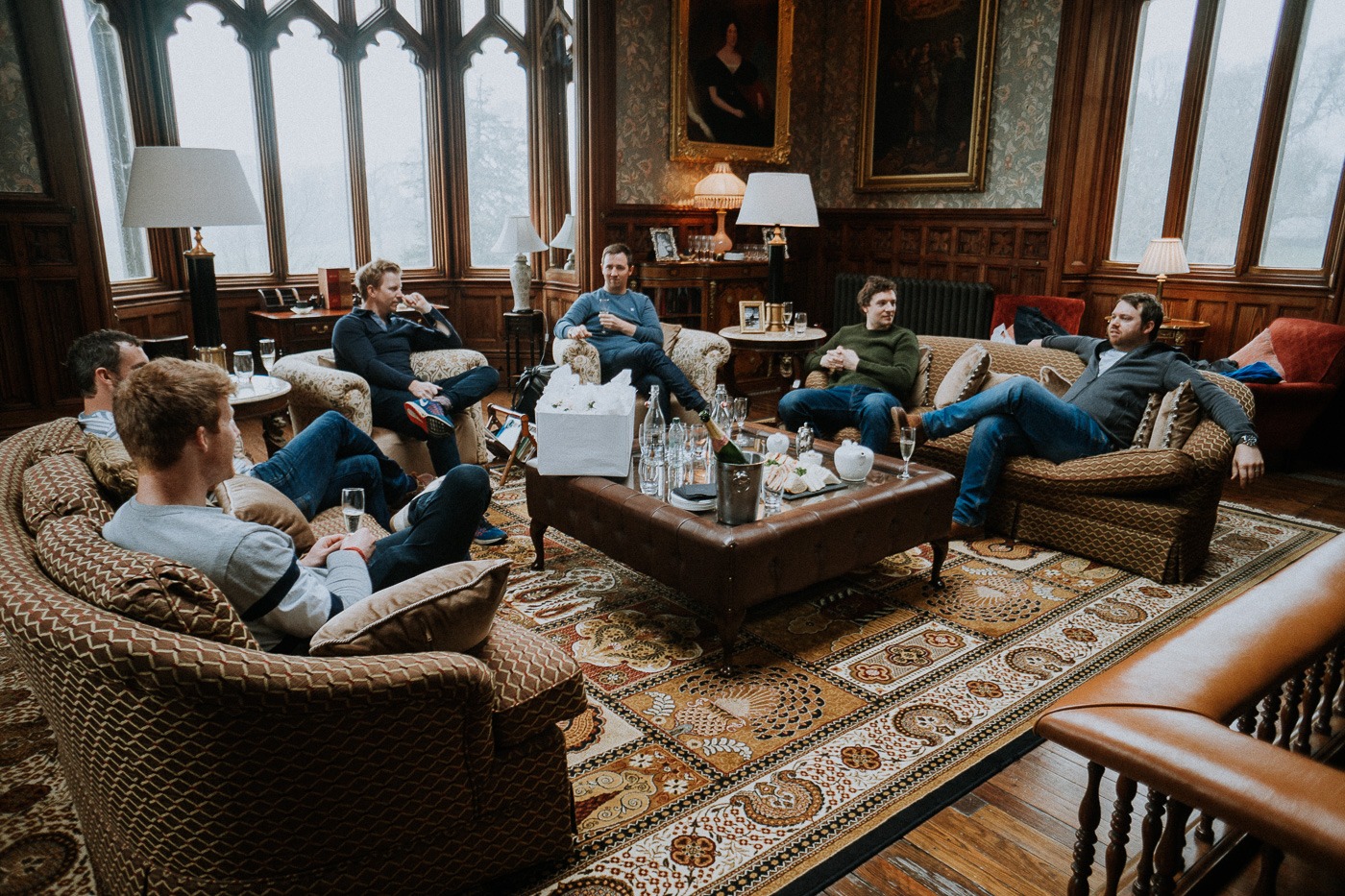 A group of people sitting around a living room