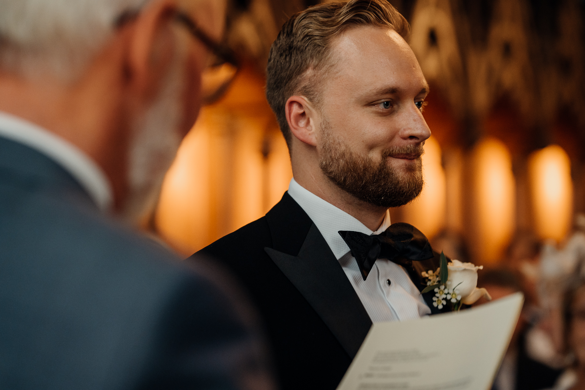 A man in a suit and bow tie