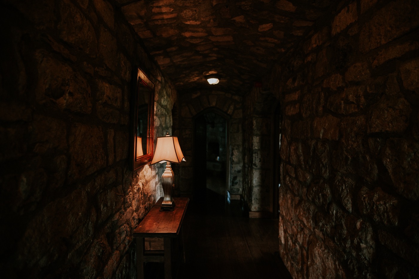 A close up of a stone building in a dark room