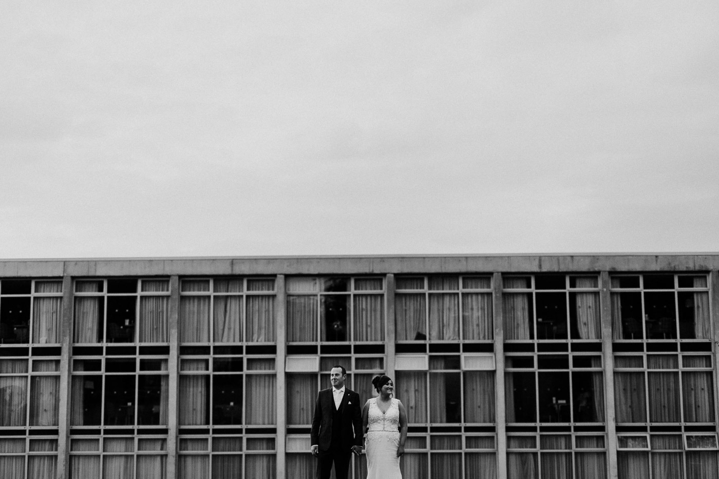 A person standing in front of a building