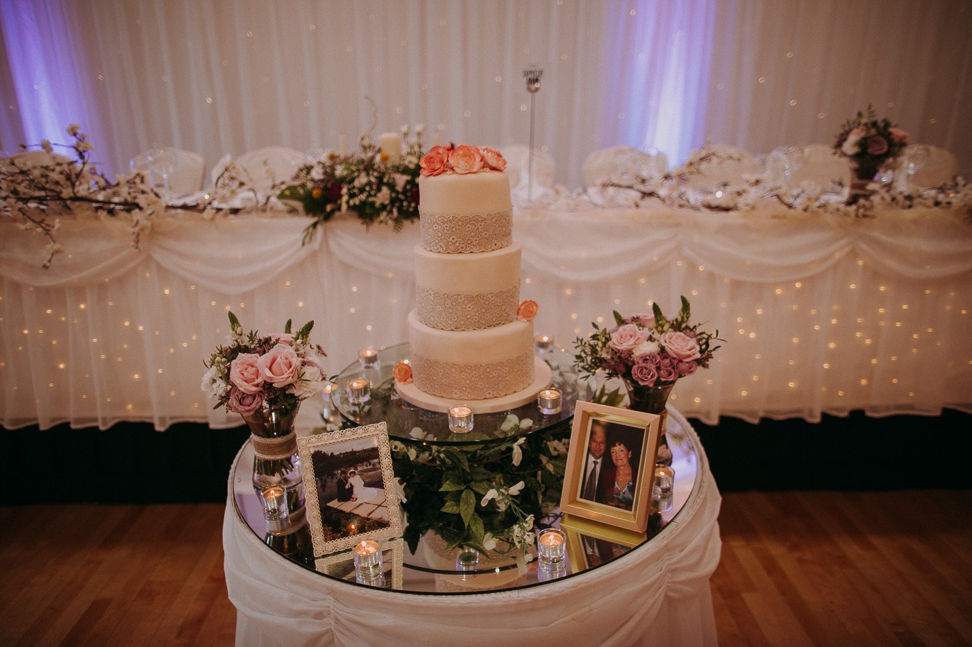 A large white cake sitting on top of a table