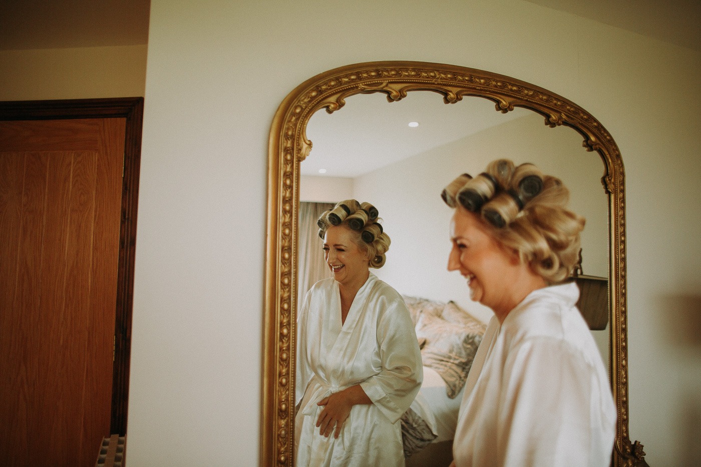 A person standing in front of a mirror posing for the camera