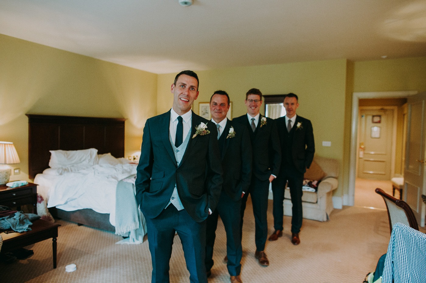 A man in a suit and tie standing in a room