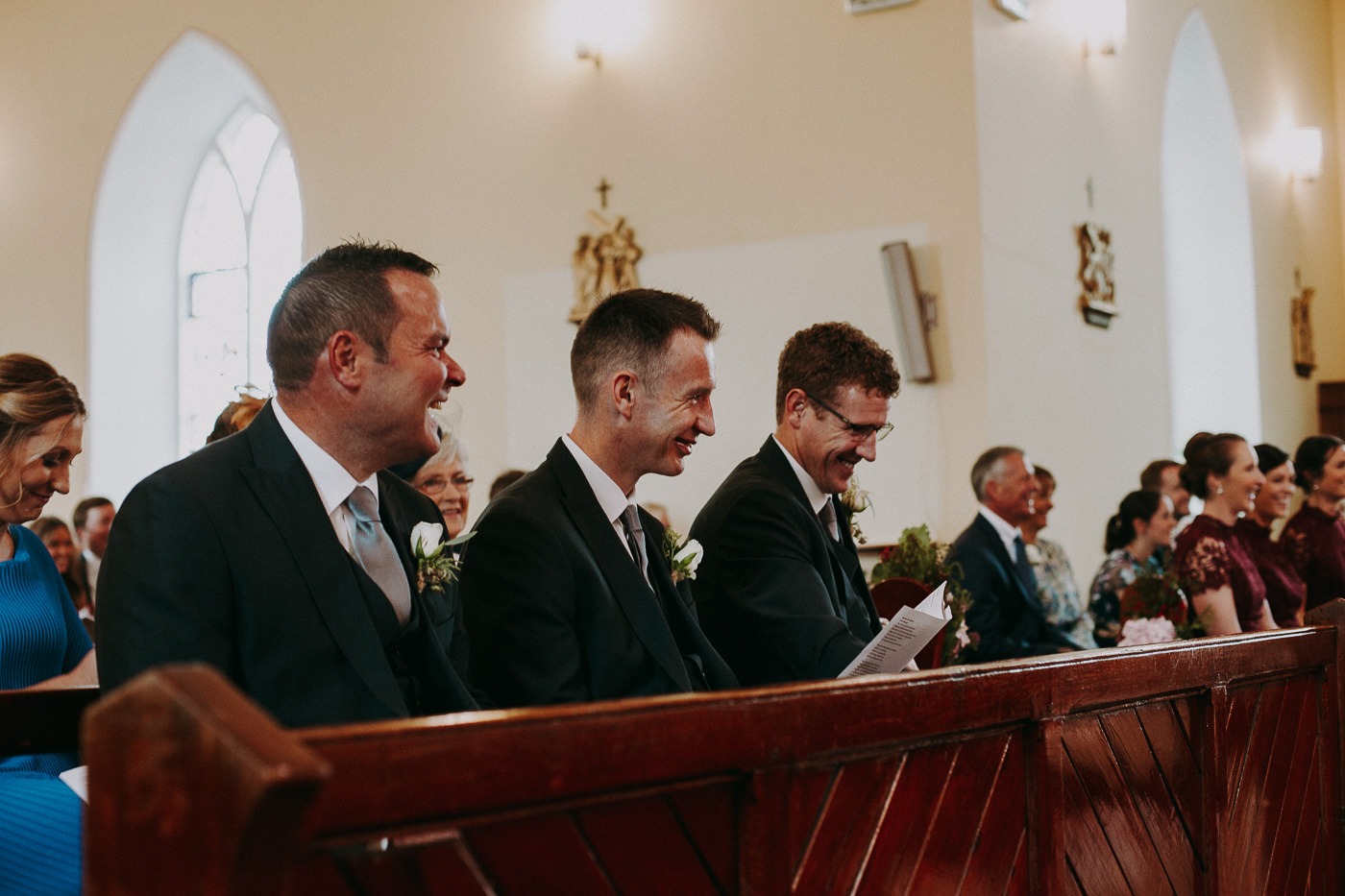 A group of people sitting at a desk