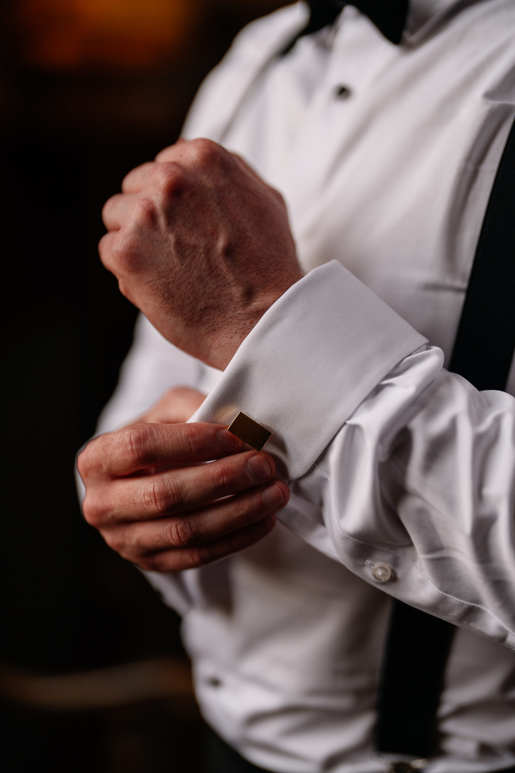 Groom adjusting his bow tie during wedding prep in Billiard Room at Markree Castle