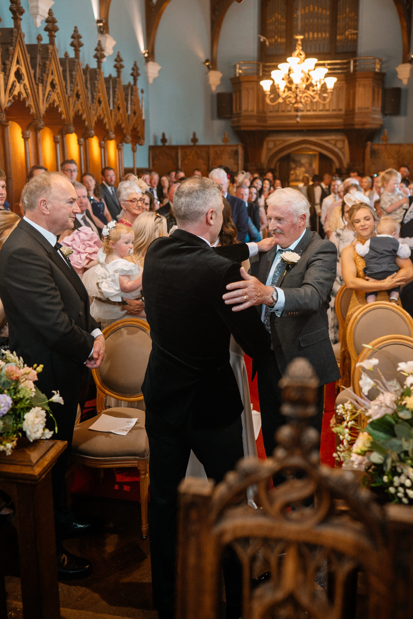 Wedding ceremony in the historic chapel at Markree Castle with natural light and emotional moments