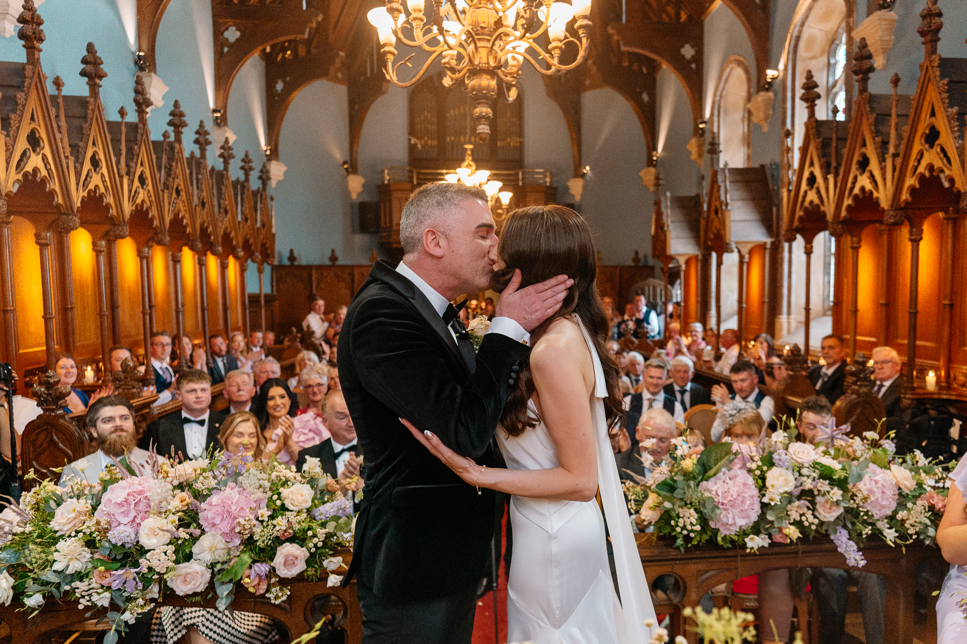 Wedding ceremony in the historic chapel at Markree Castle with natural light and emotional moments