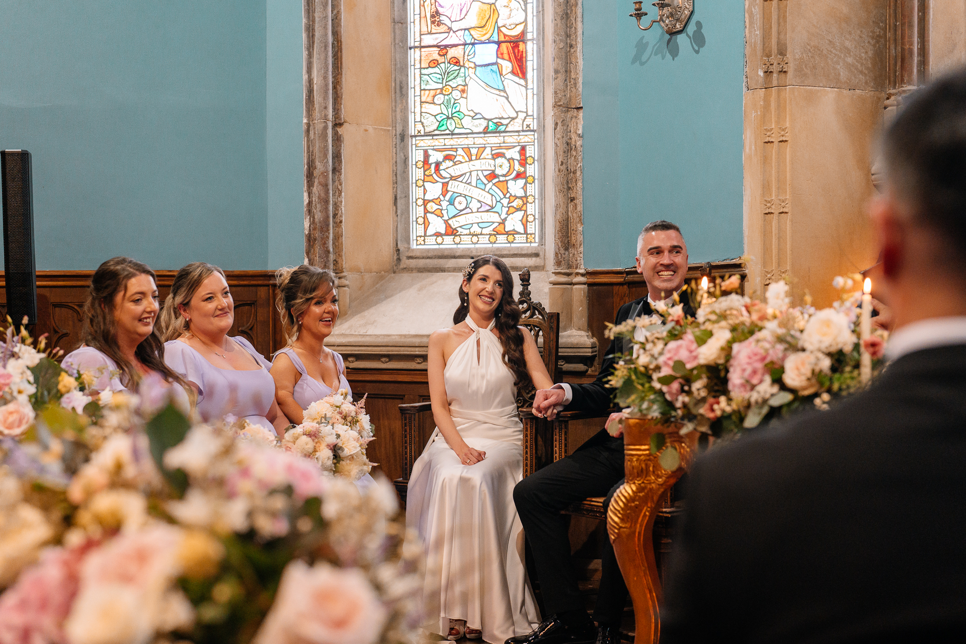 Wedding ceremony in the historic chapel at Markree Castle with natural light and emotional moments