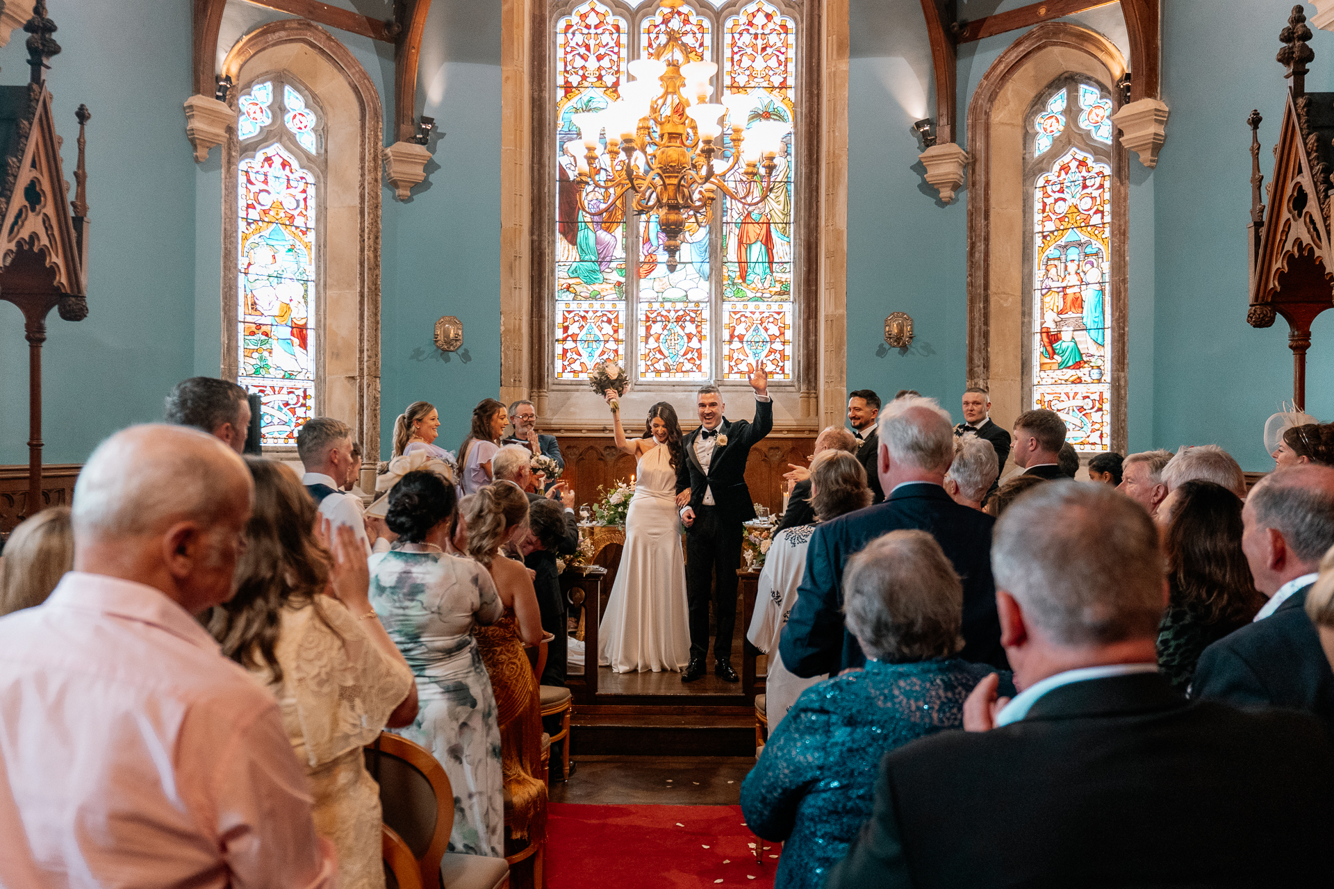Wedding ceremony in the historic chapel at Markree Castle with natural light and emotional moments