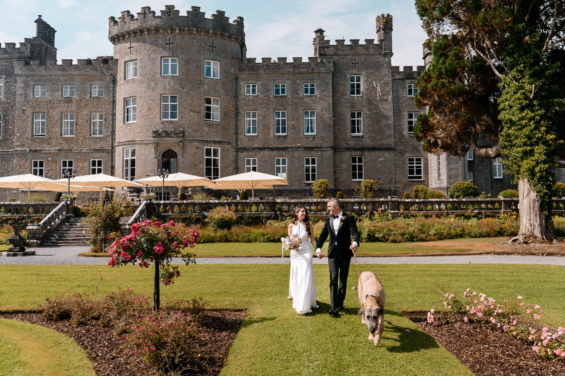 Bride and Groom with their Irish Wolfhound Fionn in the garden of Markree Castle