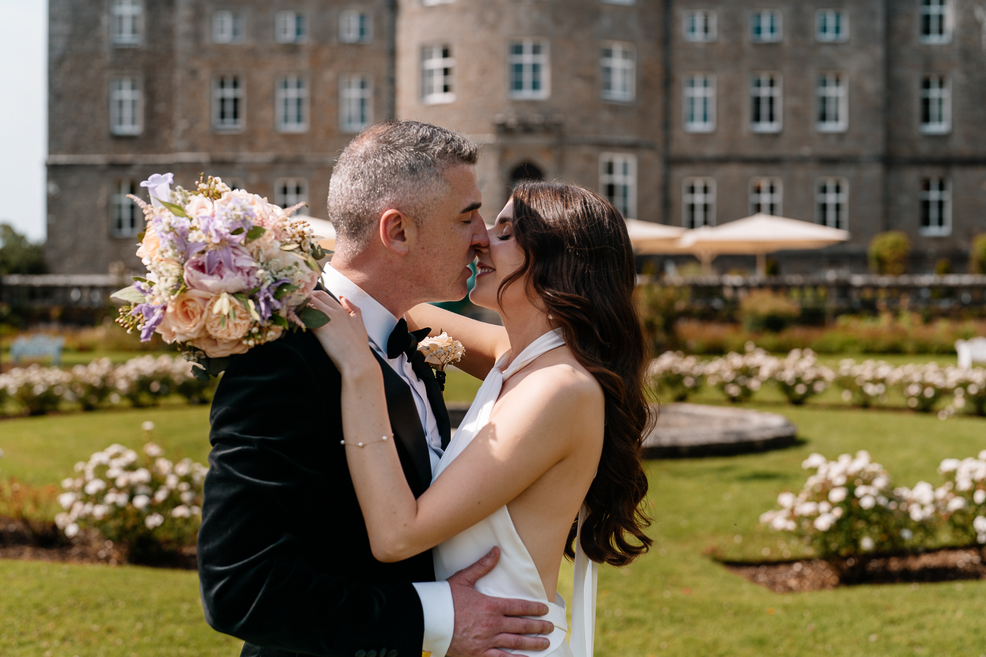 Bride and Groom walking through the garden at Markree Castle on their wedding day