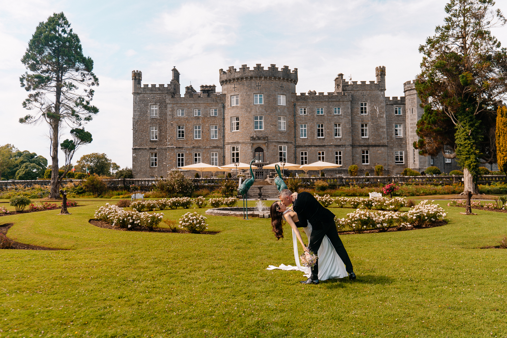 Bride and Groom walking through the garden at Markree Castle on their wedding day