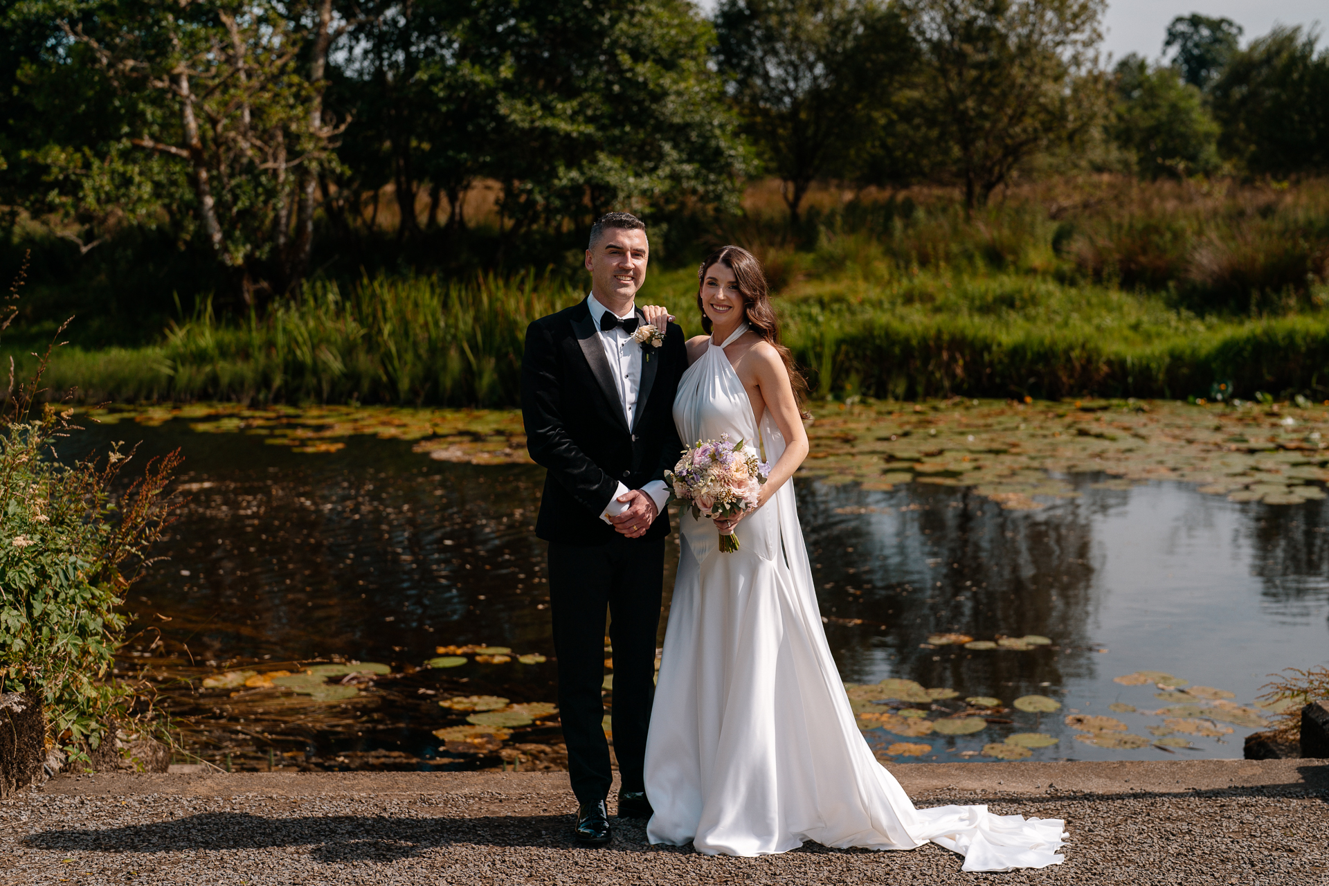 Bride and Groom walking through the garden at Markree Castle on their wedding day