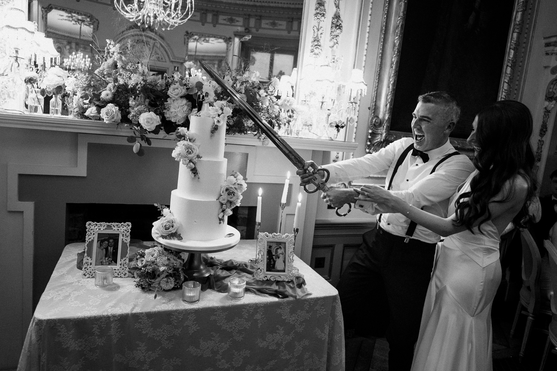 Bride and groom cutting their wedding cake in the elegant dining room of Markree Castle