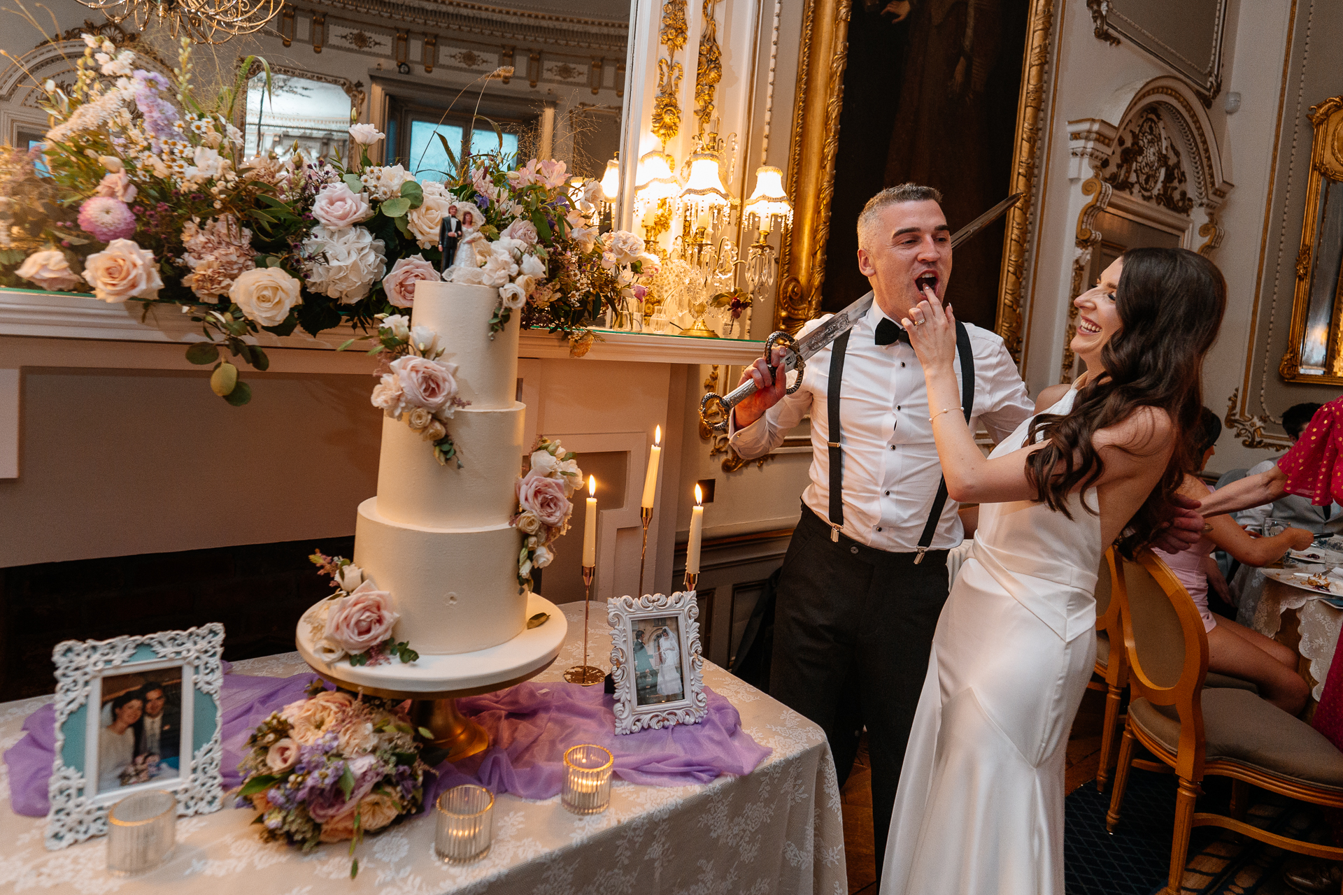 Bride and groom cutting their wedding cake in the elegant dining room of Markree Castle