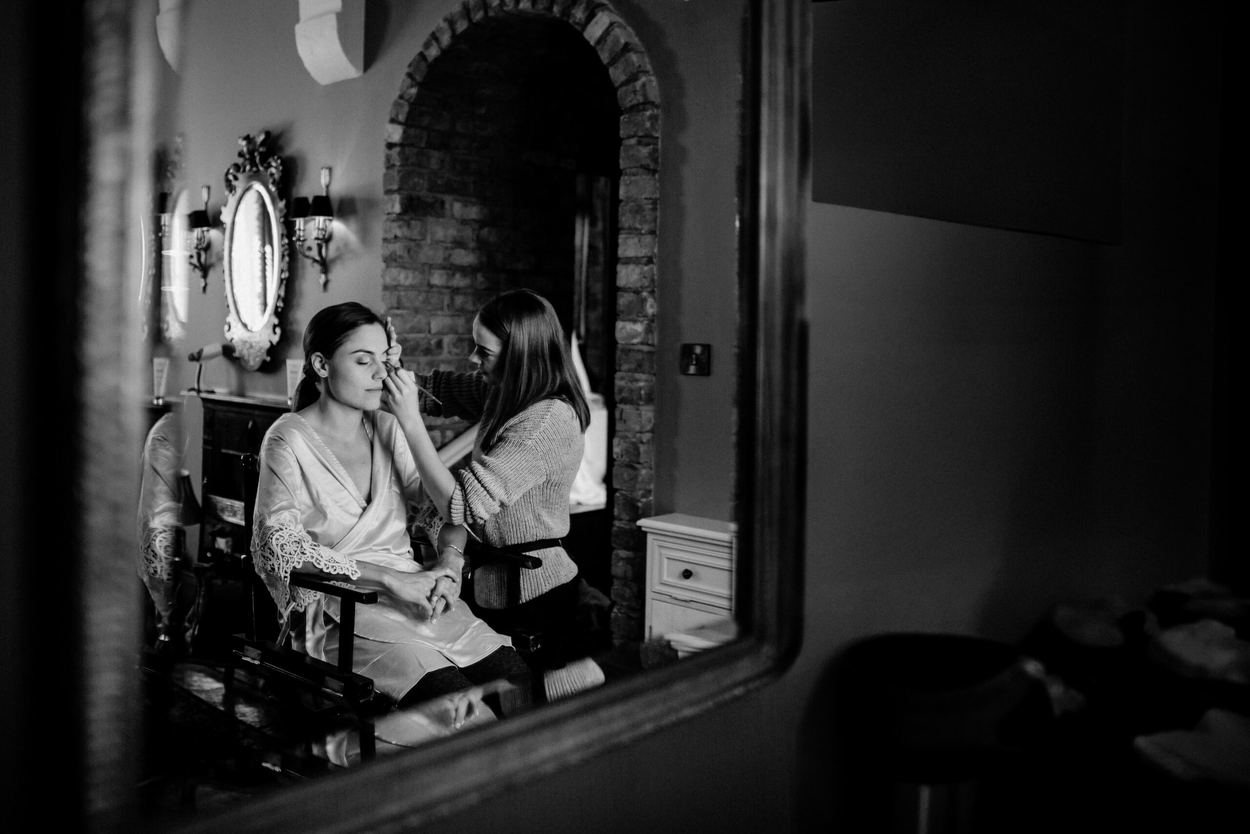 A couple of women sit in a room