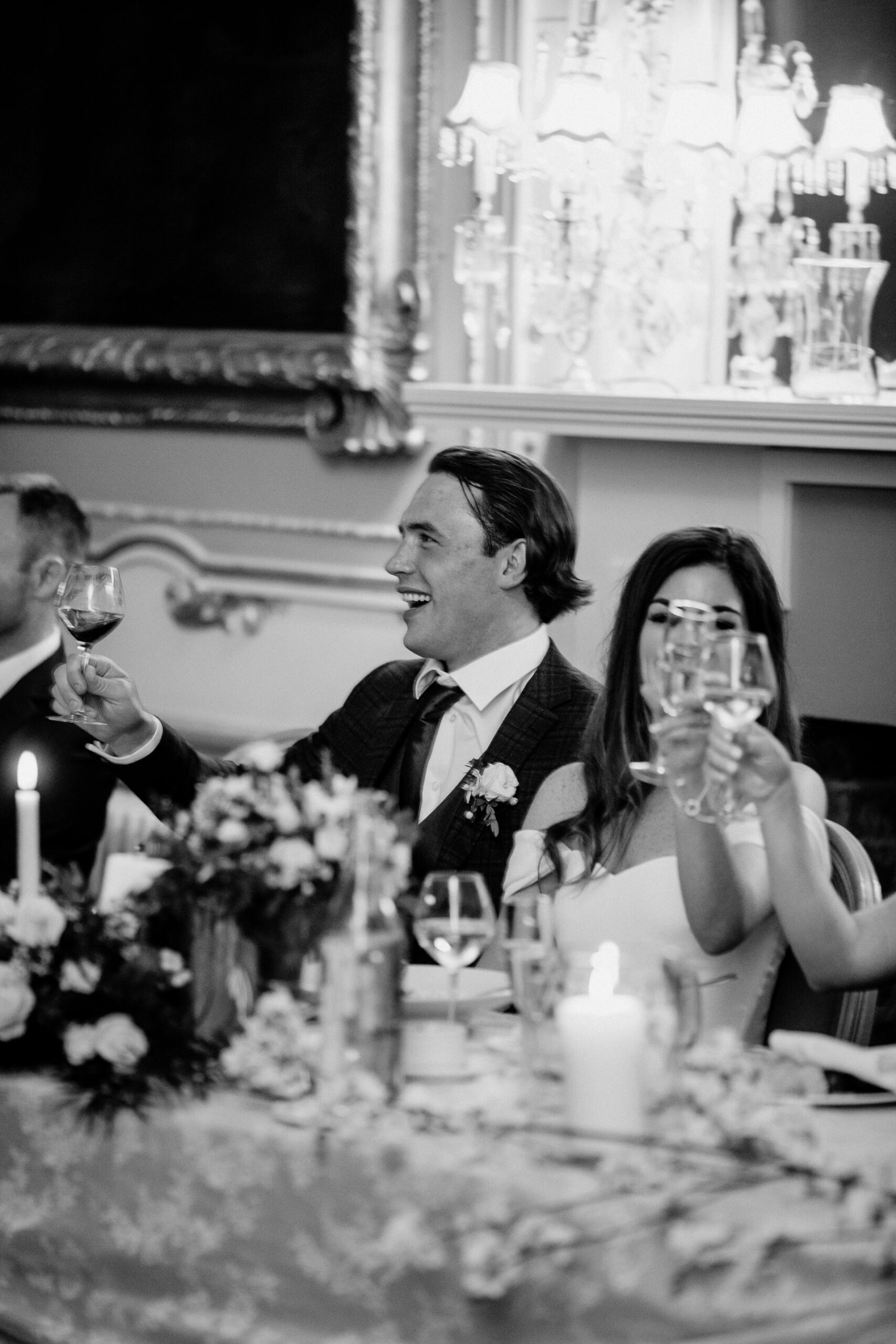 A man and woman holding wine glasses