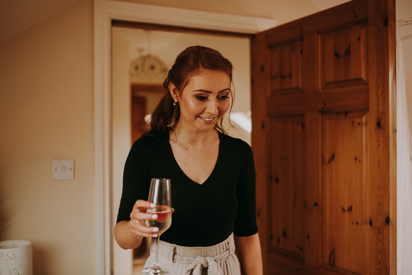 A person holding a glass of wine