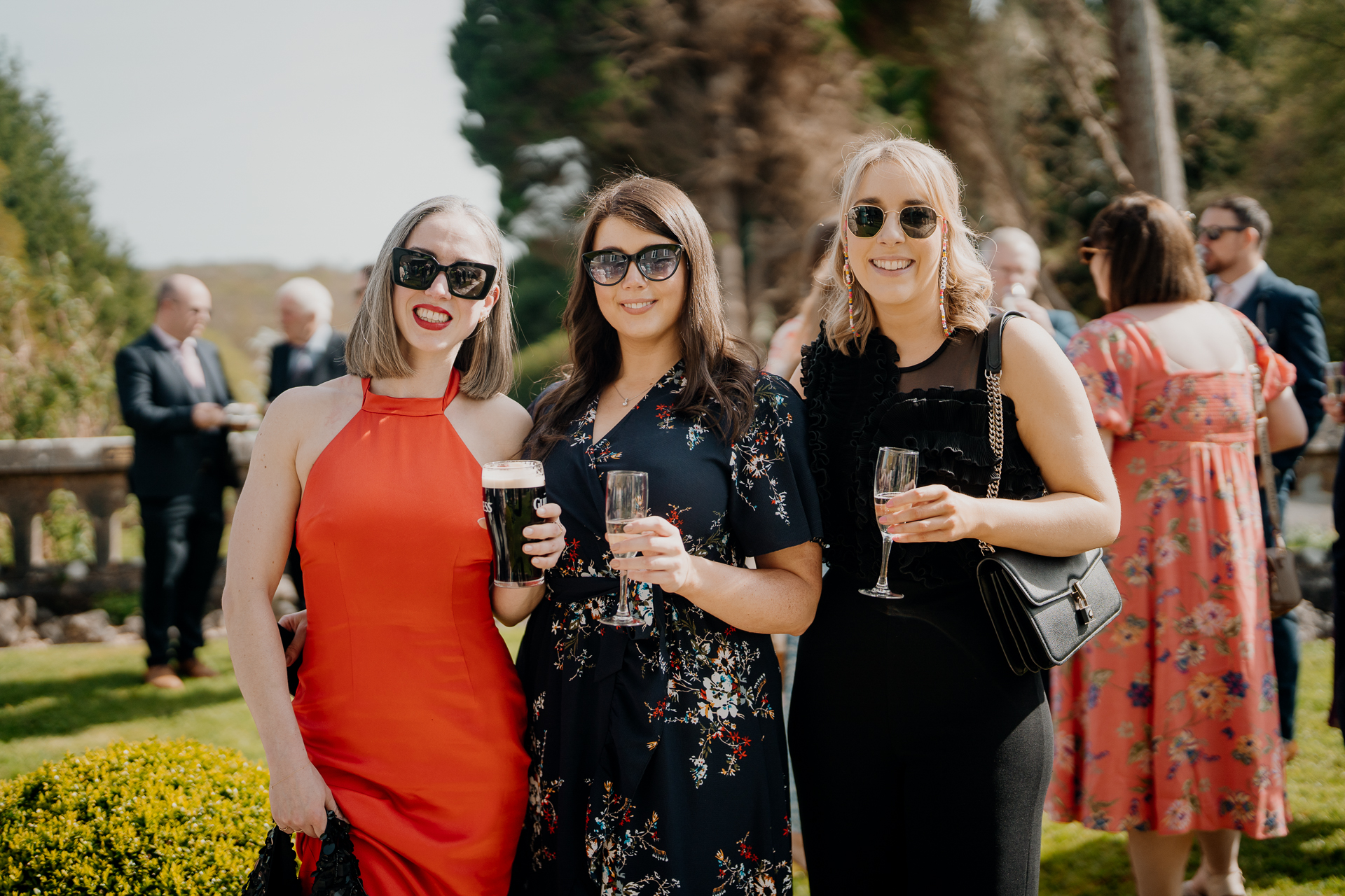 A group of women holding wine glasses