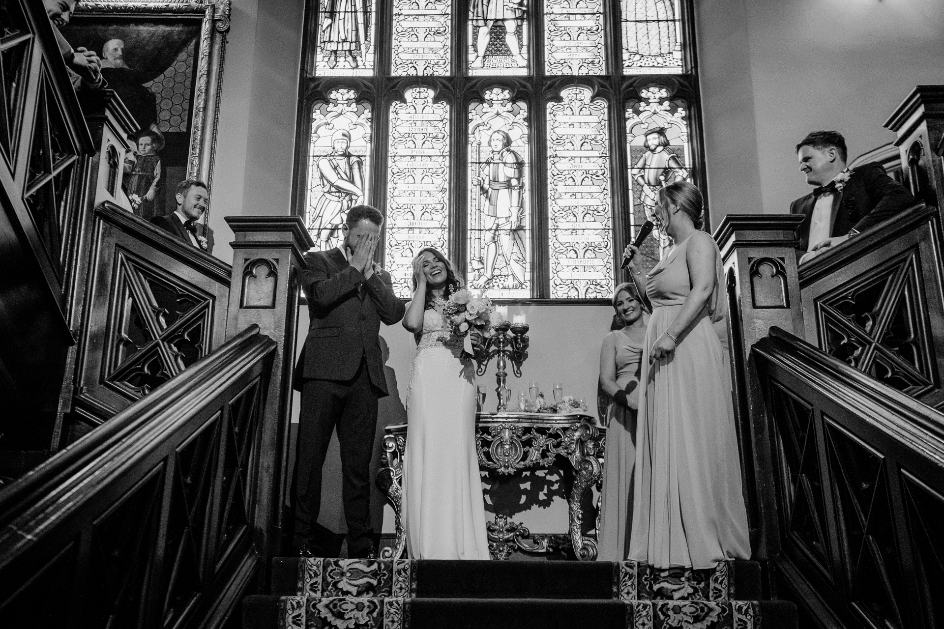 A bride and groom walking down the stairs