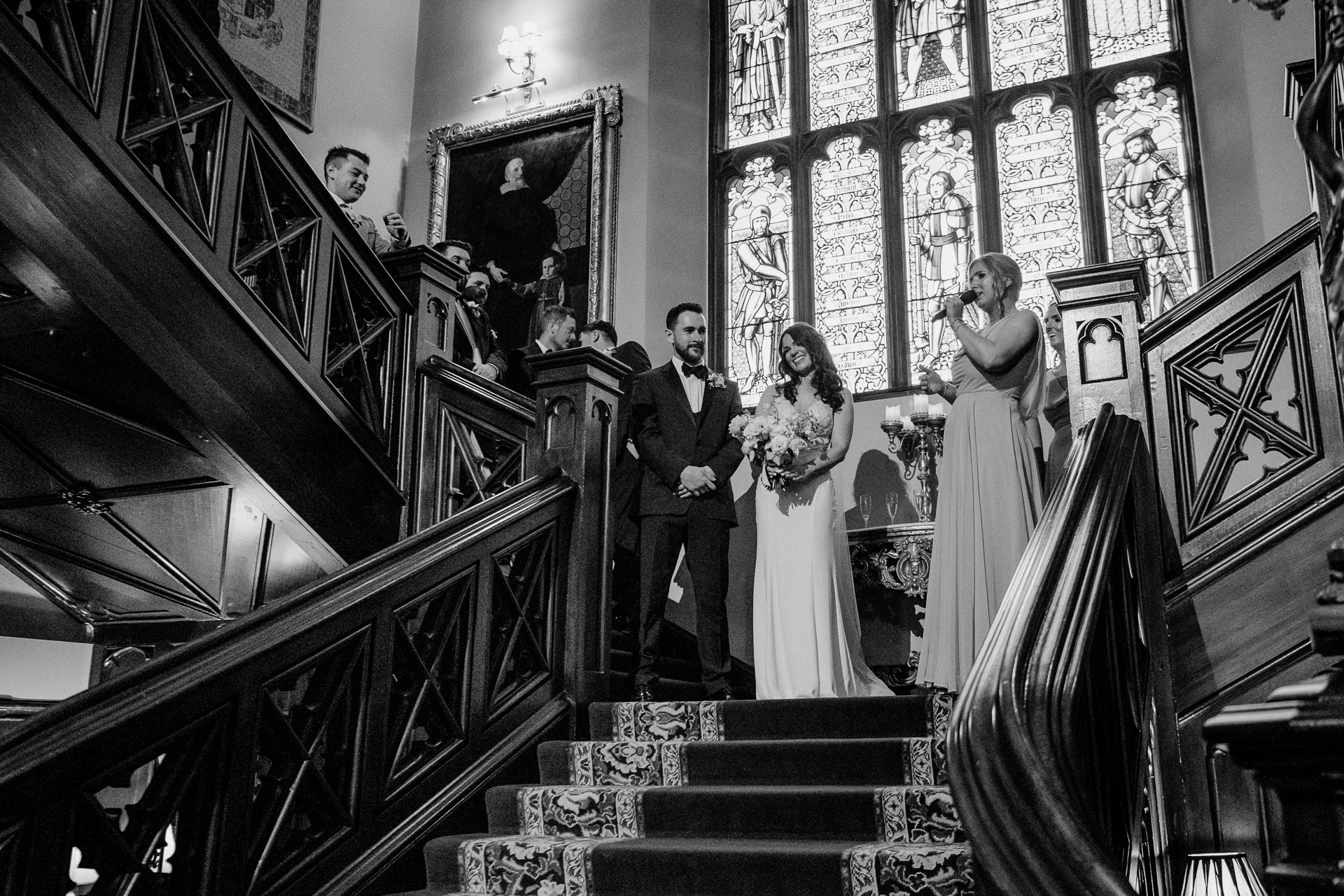 A bride and groom walking down the stairs