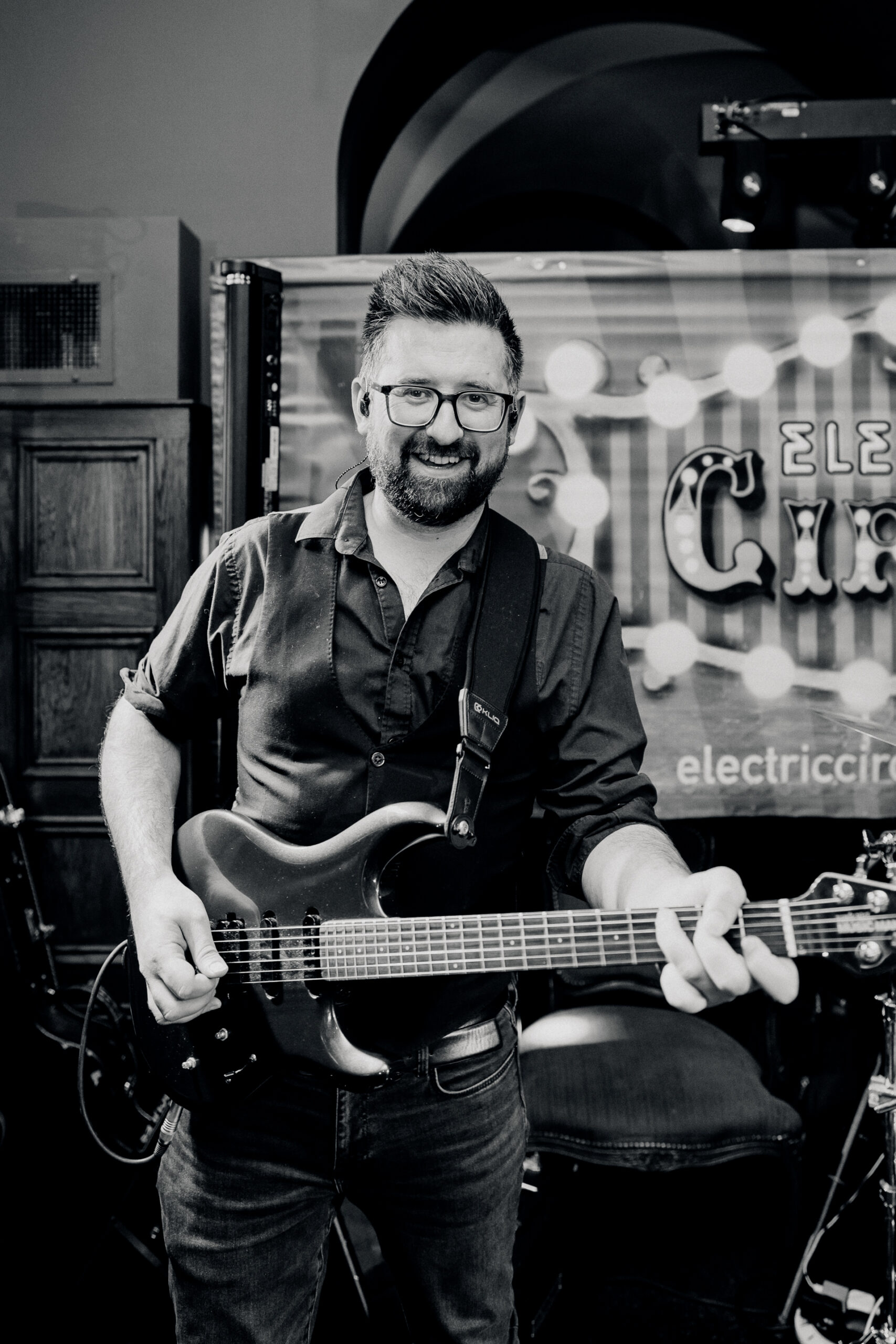 A man holding a guitar